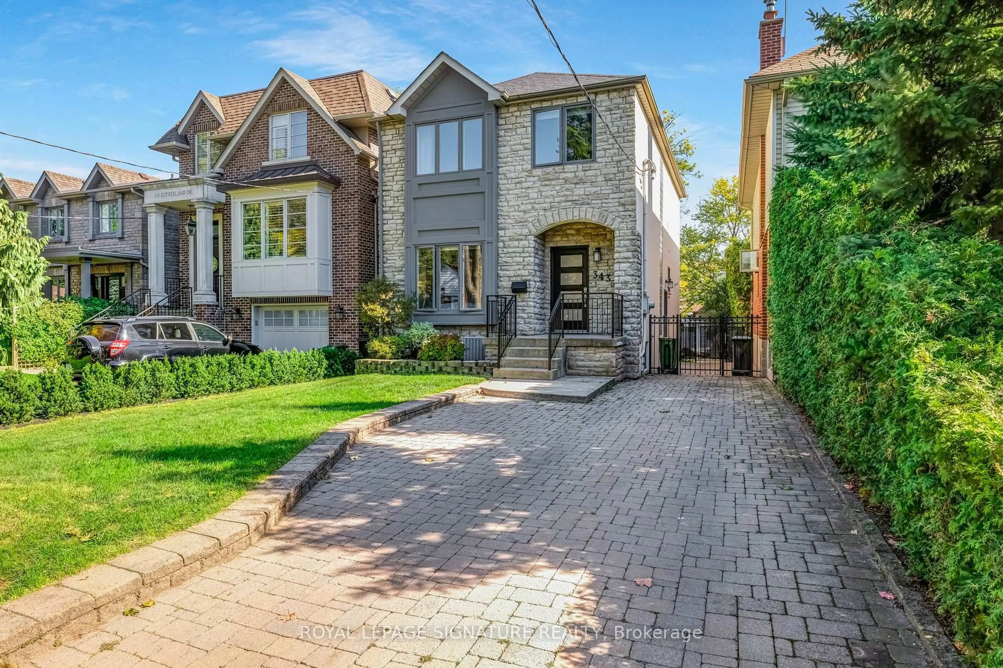 Home with brick exterior material, street for 343 Sutherland Dr, Toronto Ontario M4G 1J7