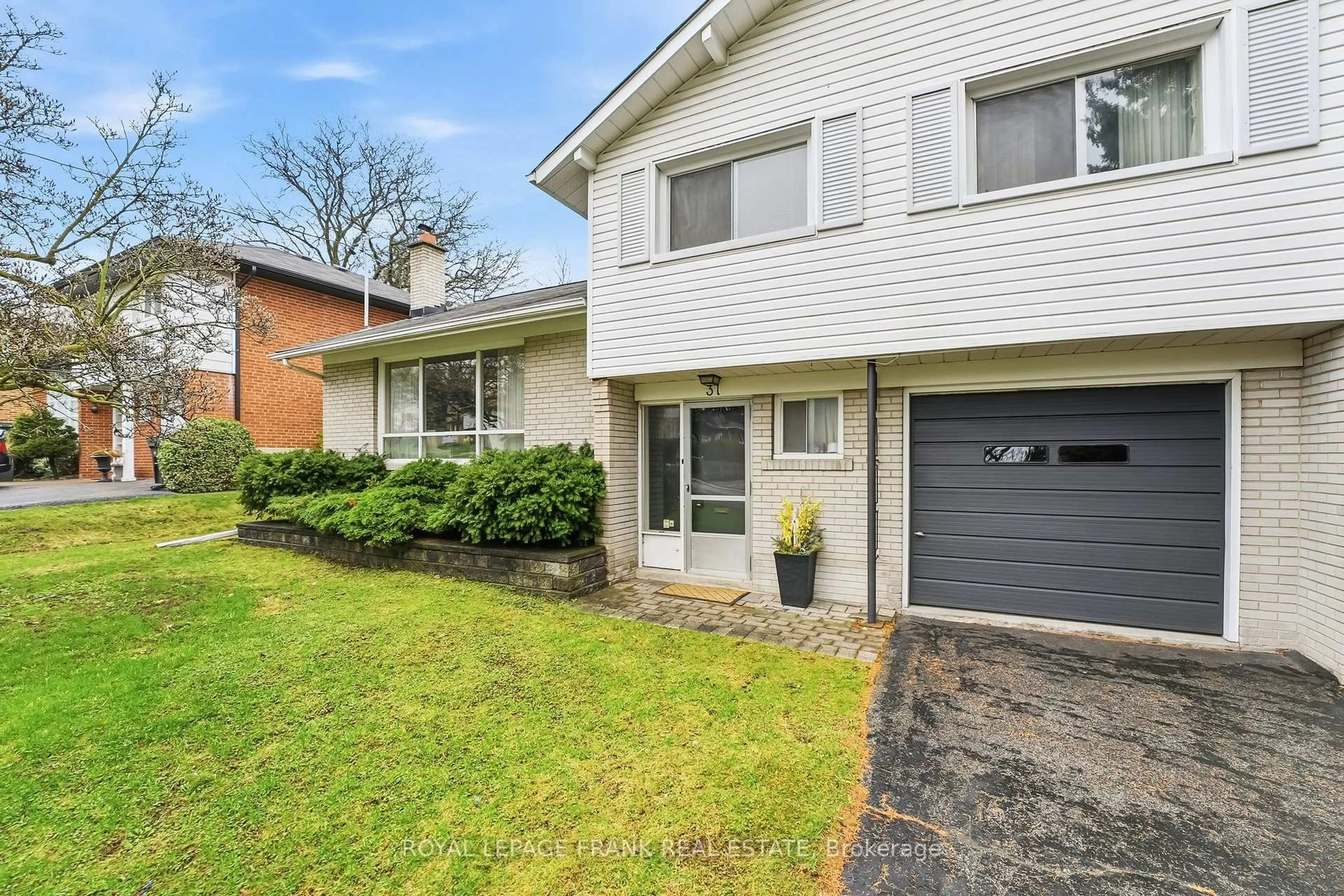 Home with brick exterior material, street for 31 Cobham Cres, Toronto Ontario M4A 1V7