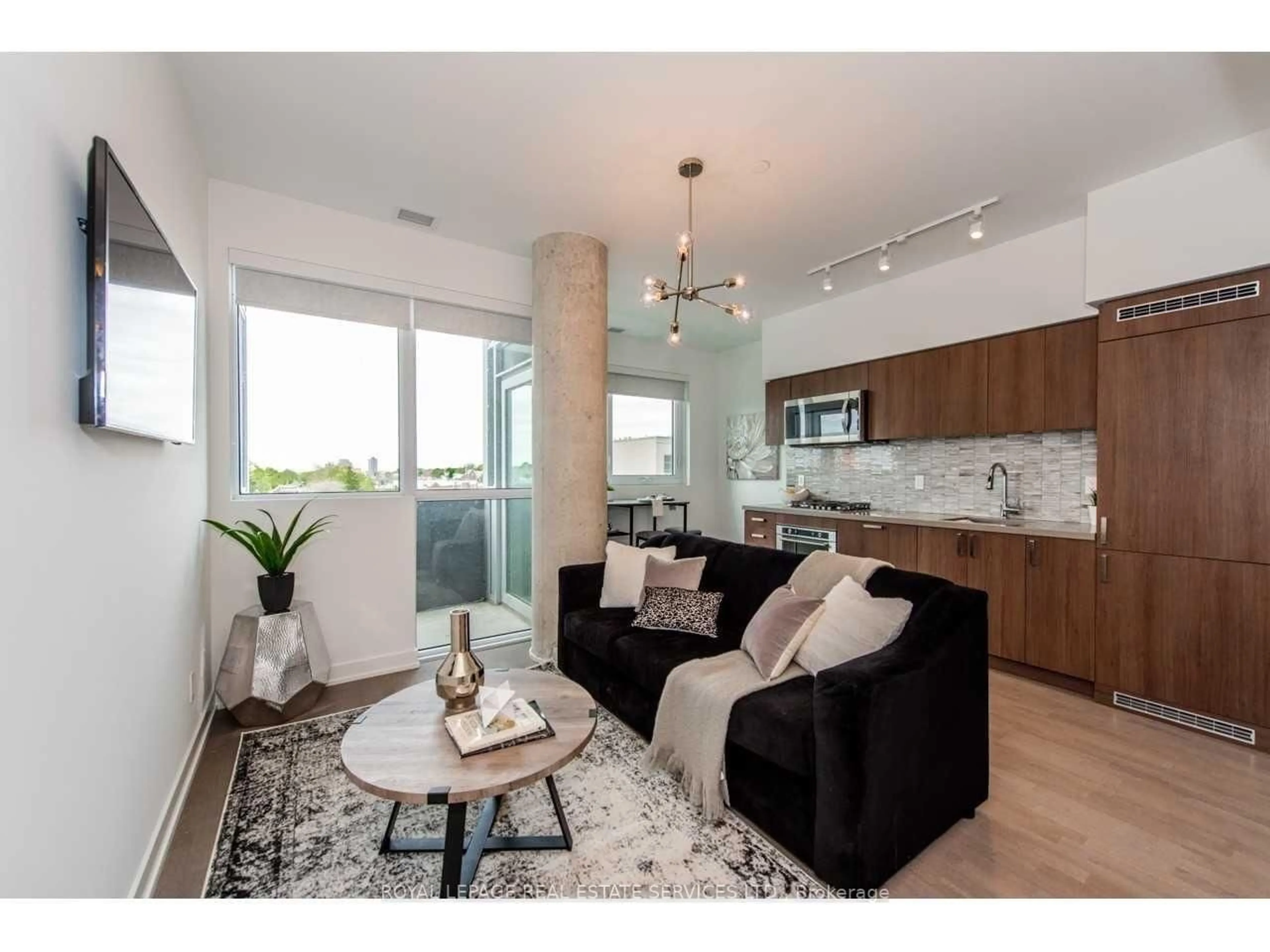 Living room with furniture, wood/laminate floor for 501 St Clair Ave #418, Toronto Ontario M5P 0A2