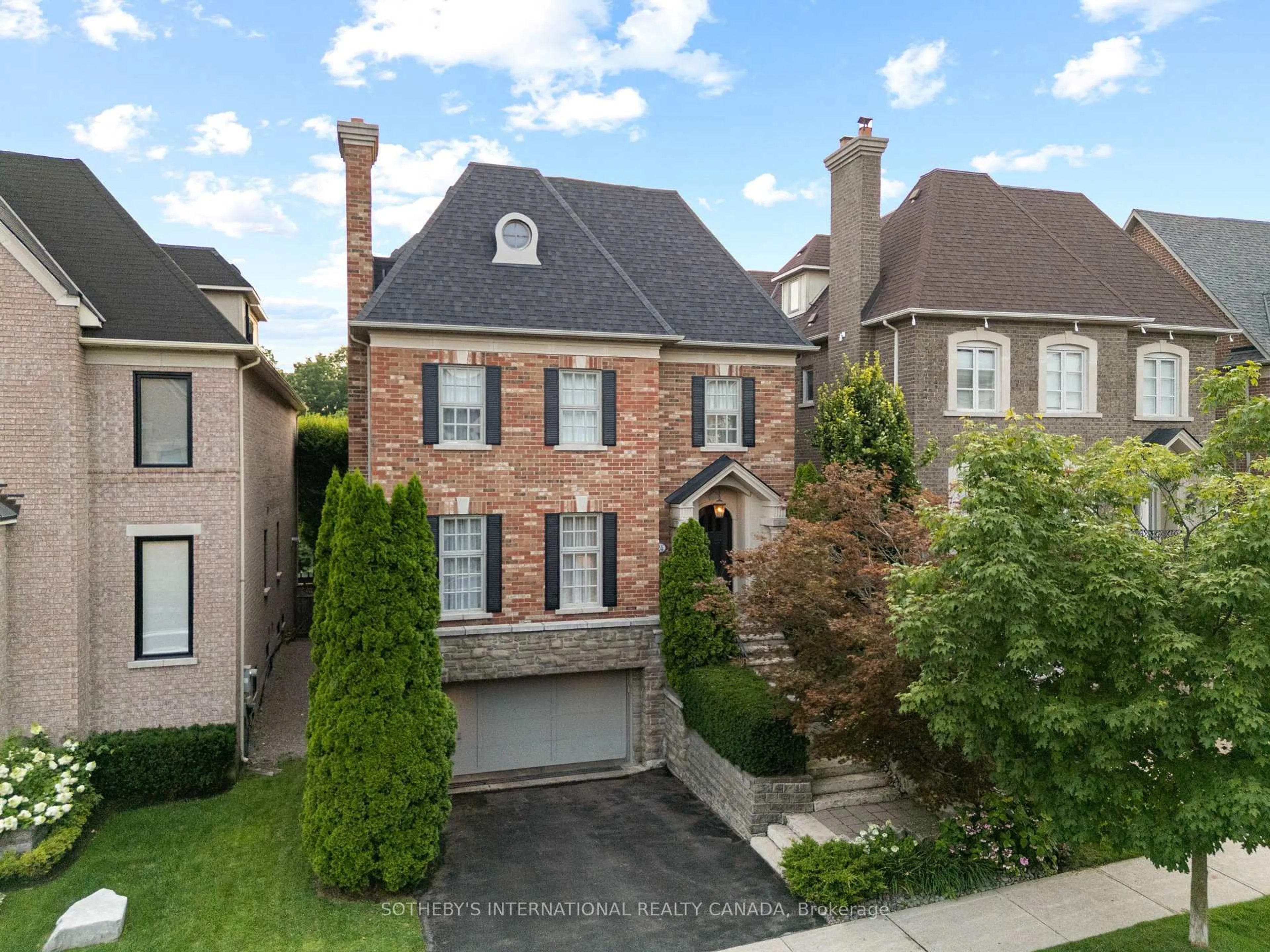 Home with brick exterior material, street for 24 True Davidson Dr, Toronto Ontario M4W 3X5
