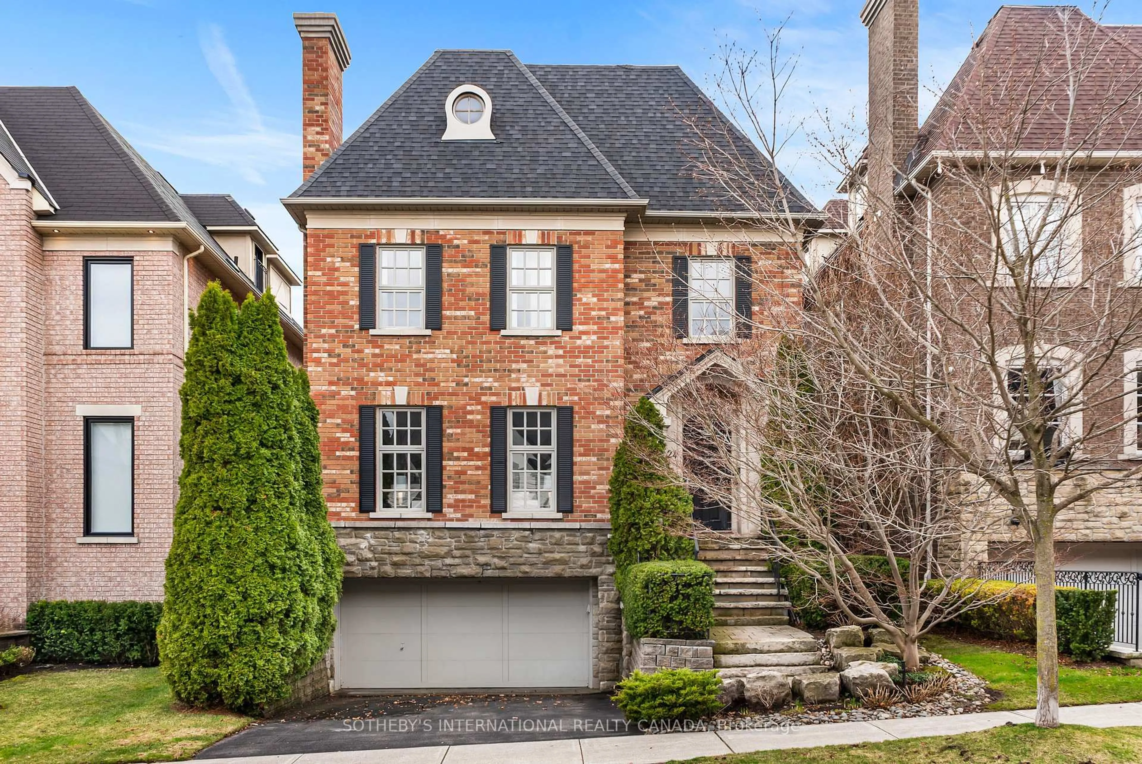 Home with brick exterior material, street for 24 True Davidson Dr, Toronto Ontario M4W 3X5