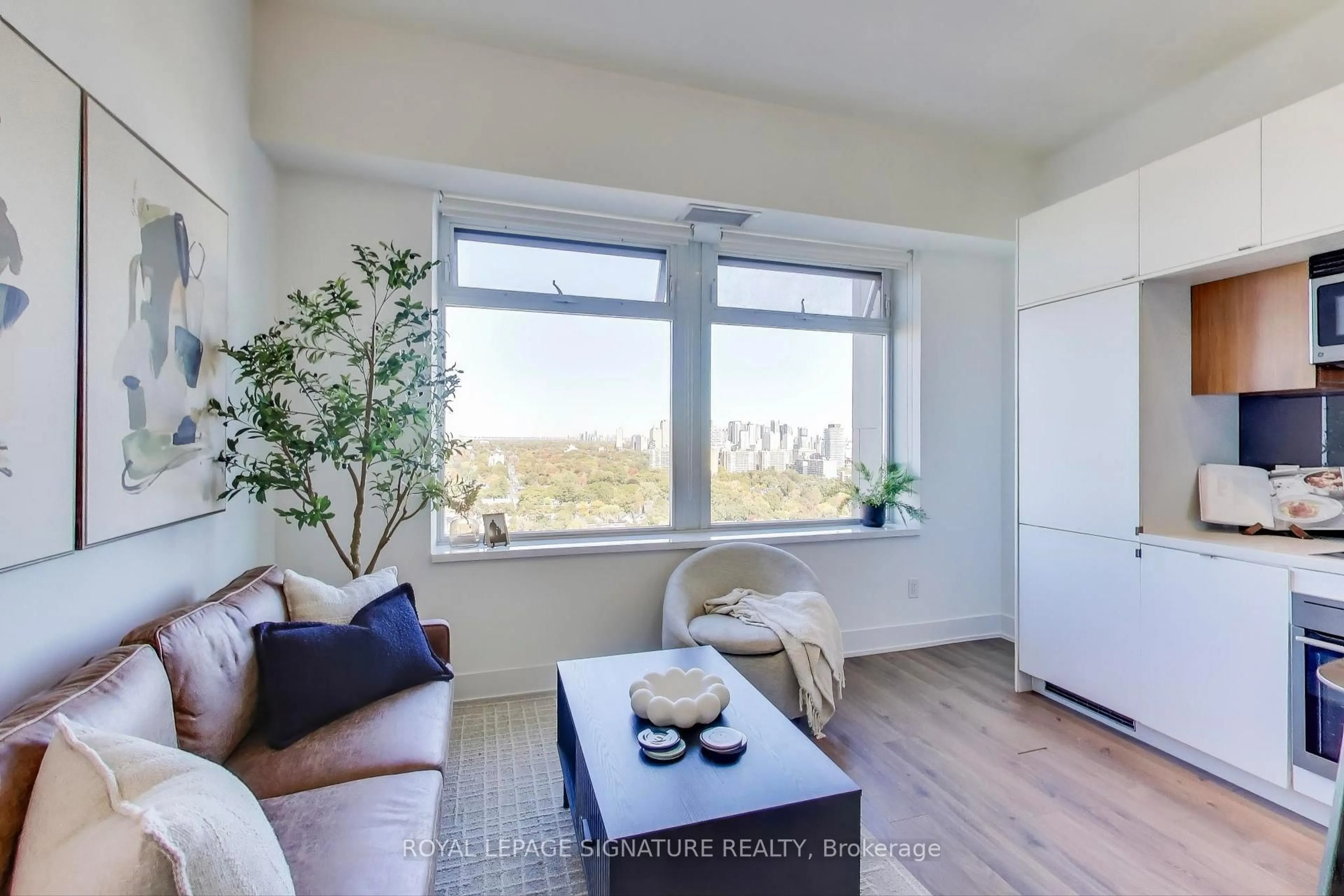 Living room with furniture, wood/laminate floor for 111 St Clair Ave #1826, Toronto Ontario M4V 1N5