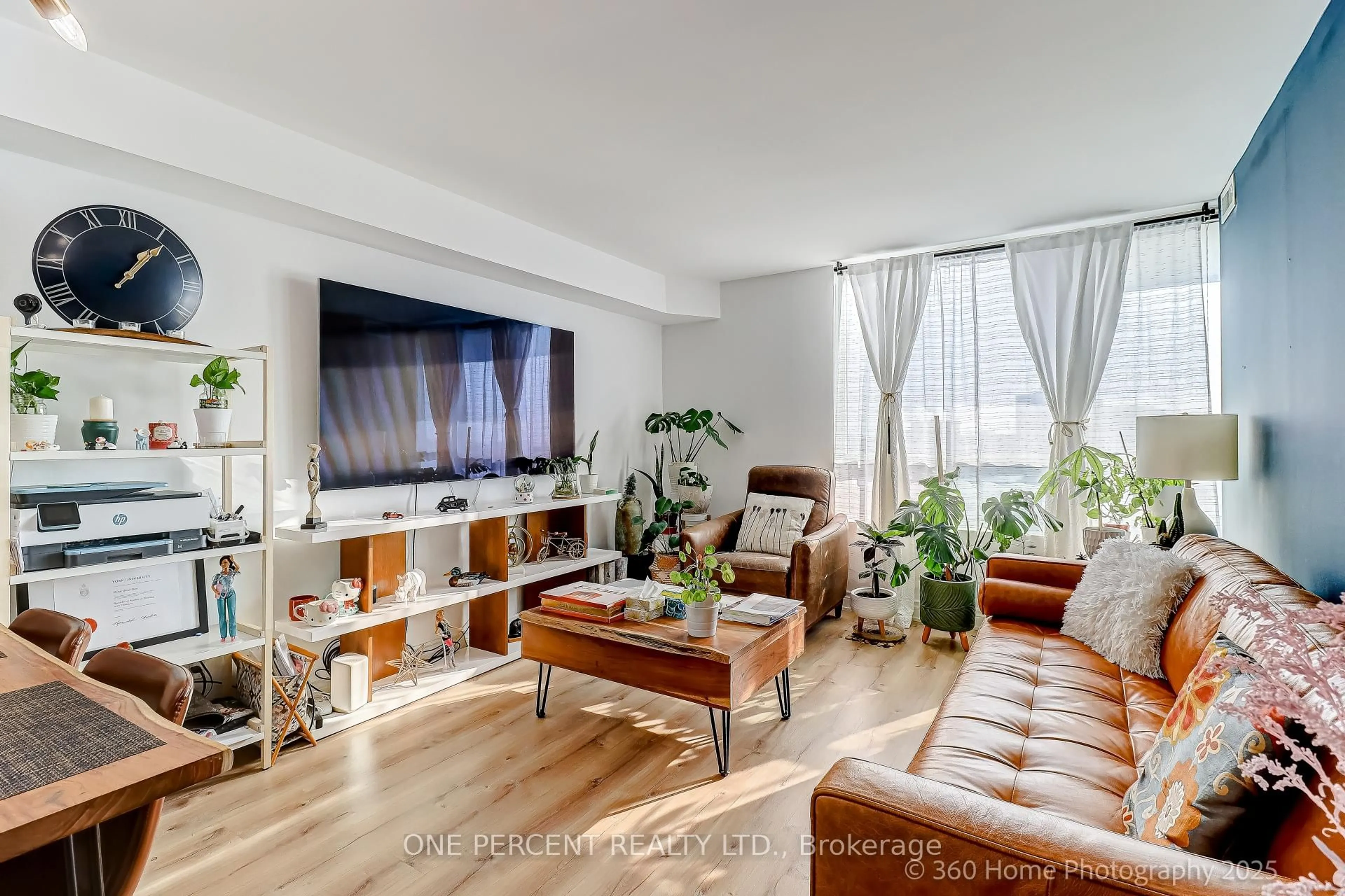 Living room with furniture, wood/laminate floor for 8 Covington Rd #803, Toronto Ontario M6A 3E5