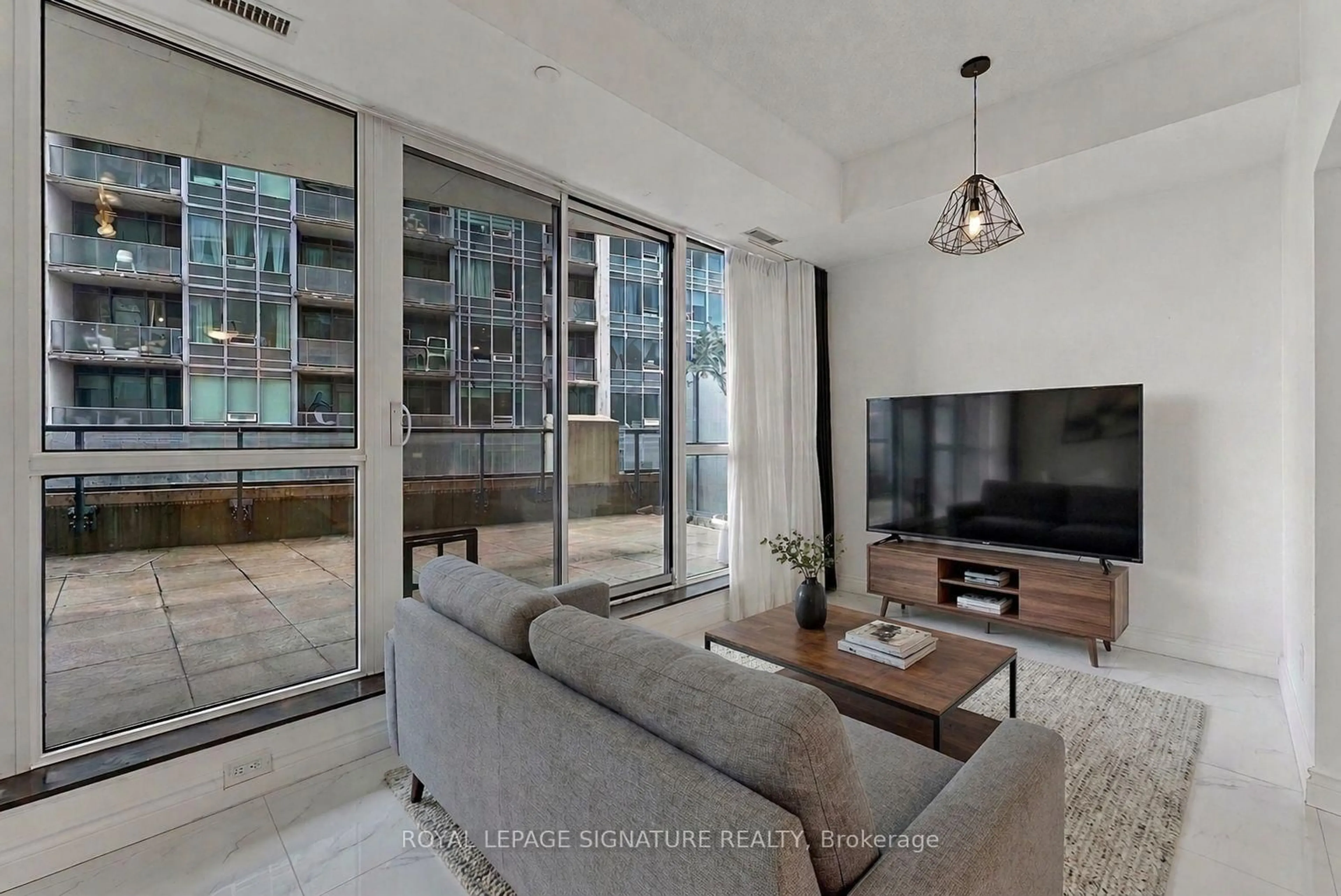 Living room with furniture, cement floor for 51 East Liberty St #517, Toronto Ontario M6K 3P8