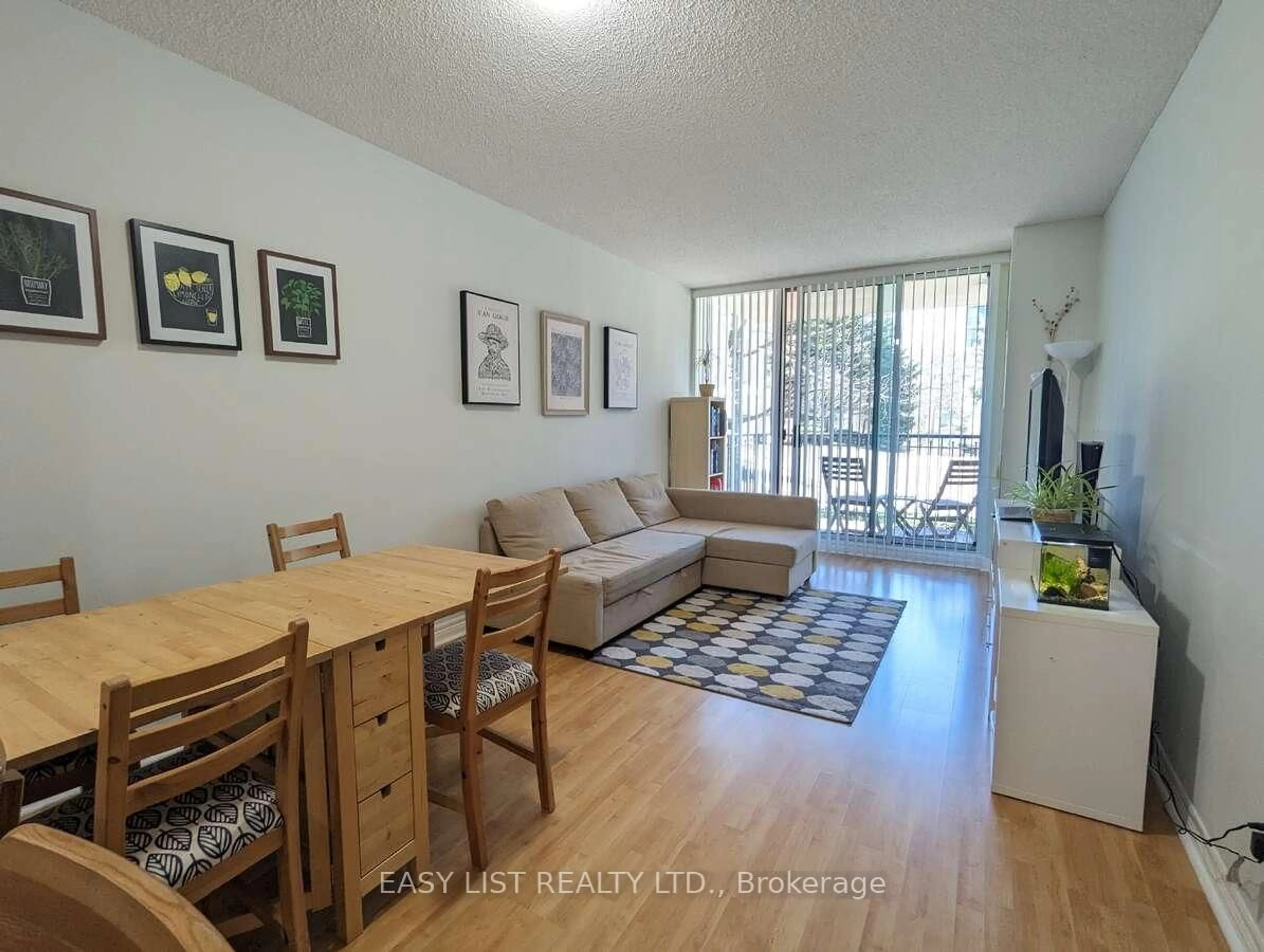 Living room with furniture, wood/laminate floor for 38 William Carson Cres #222, Toronto Ontario M2P 2H2