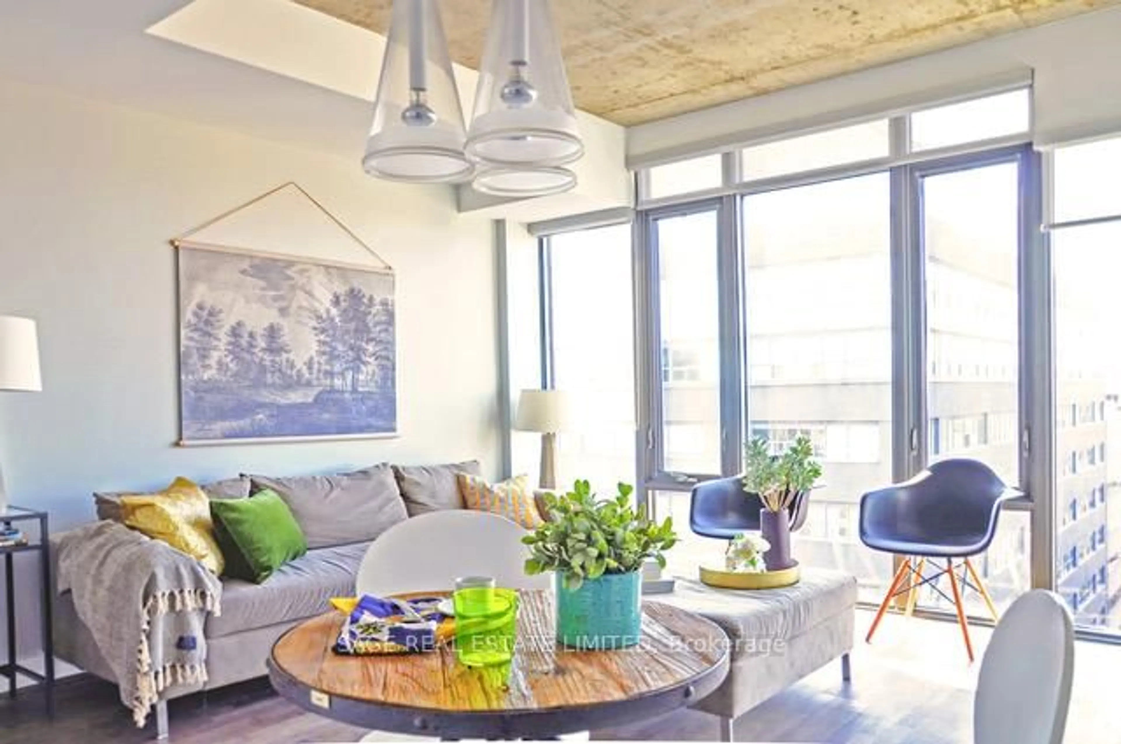 Living room with furniture, cement floor for 95 Bathurst St #1406, Toronto Ontario M5V 0H7