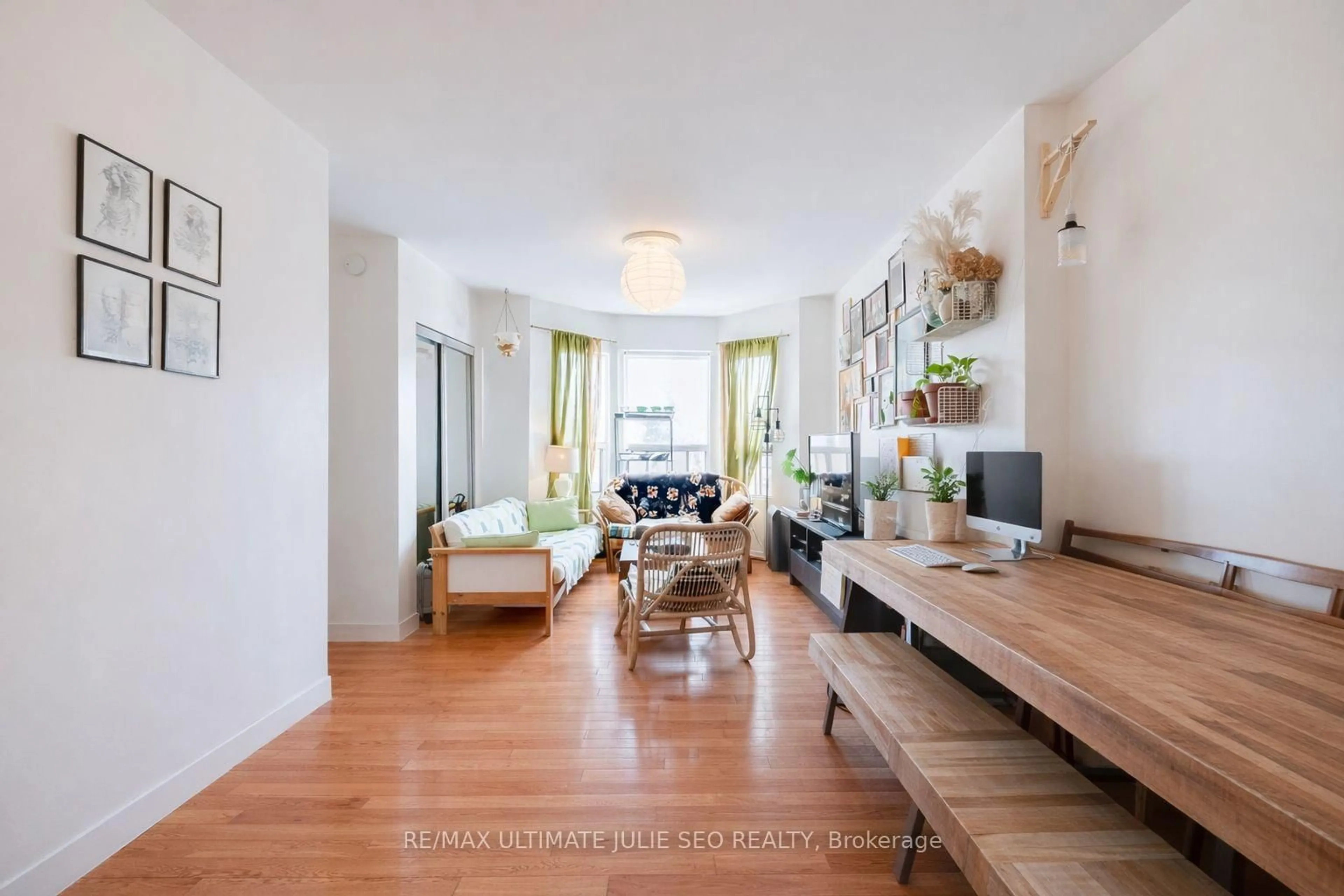 Living room with furniture, wood/laminate floor for 1206 Ossington Ave, Toronto Ontario M6G 3W1