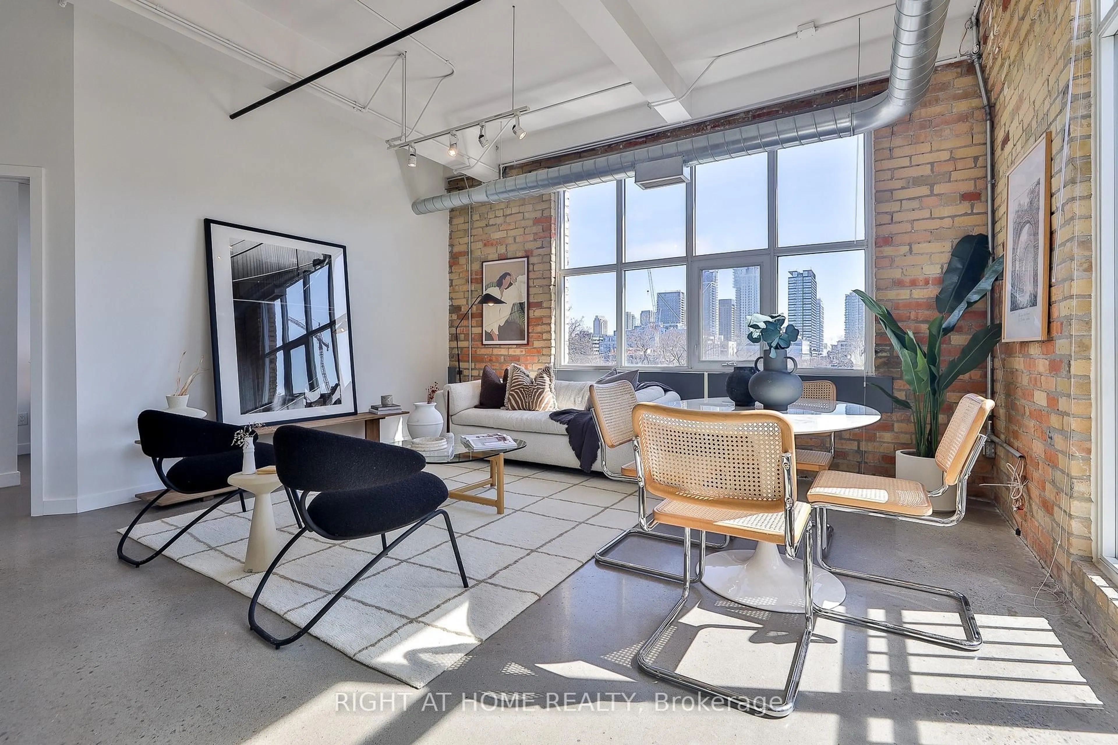 Living room with furniture, cement floor for 955 Queen St #519, Toronto Ontario M6J 3X5