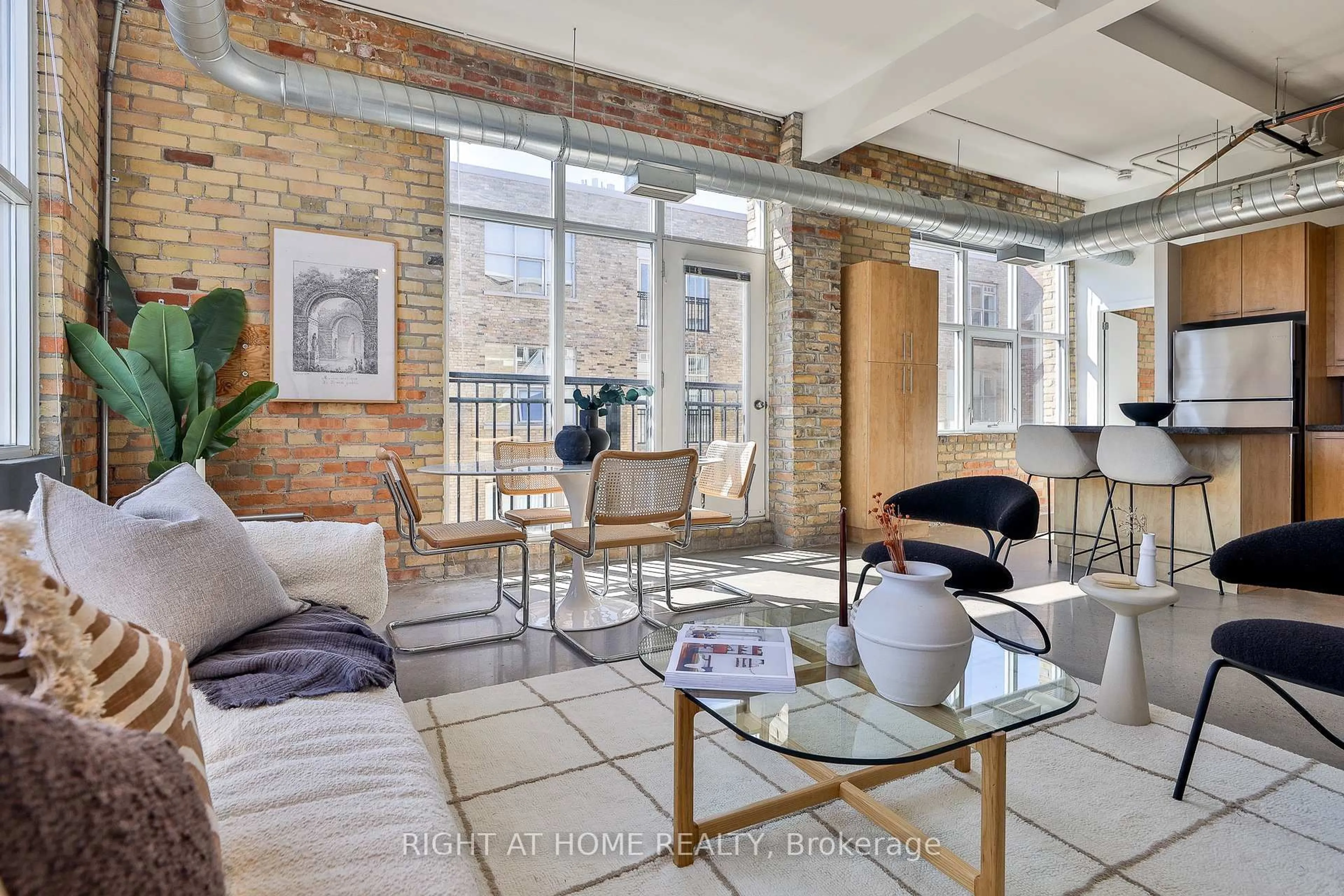 Living room with furniture, cement floor for 955 Queen St #519, Toronto Ontario M6J 3X5