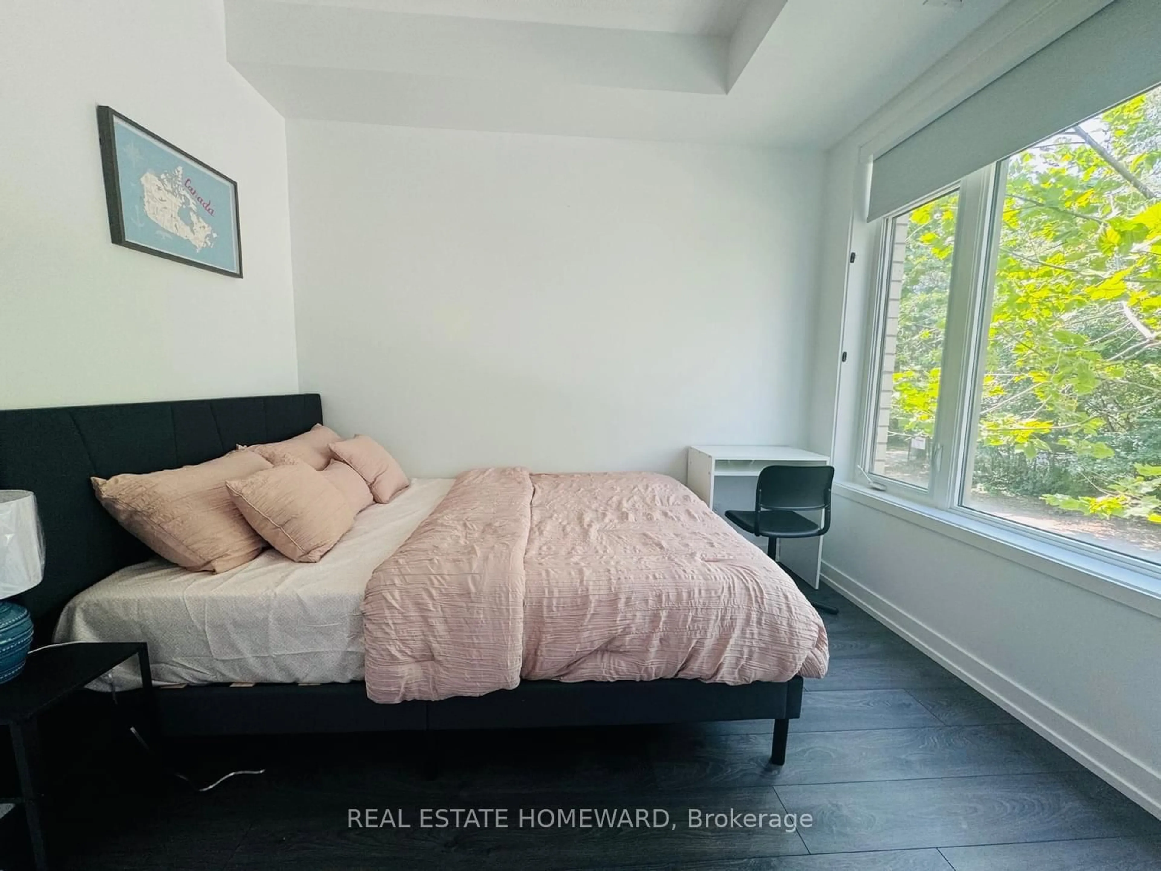 Bedroom with bed, wood/laminate floor for 17 St. Bartholomew St, Toronto Ontario M5A 0A3