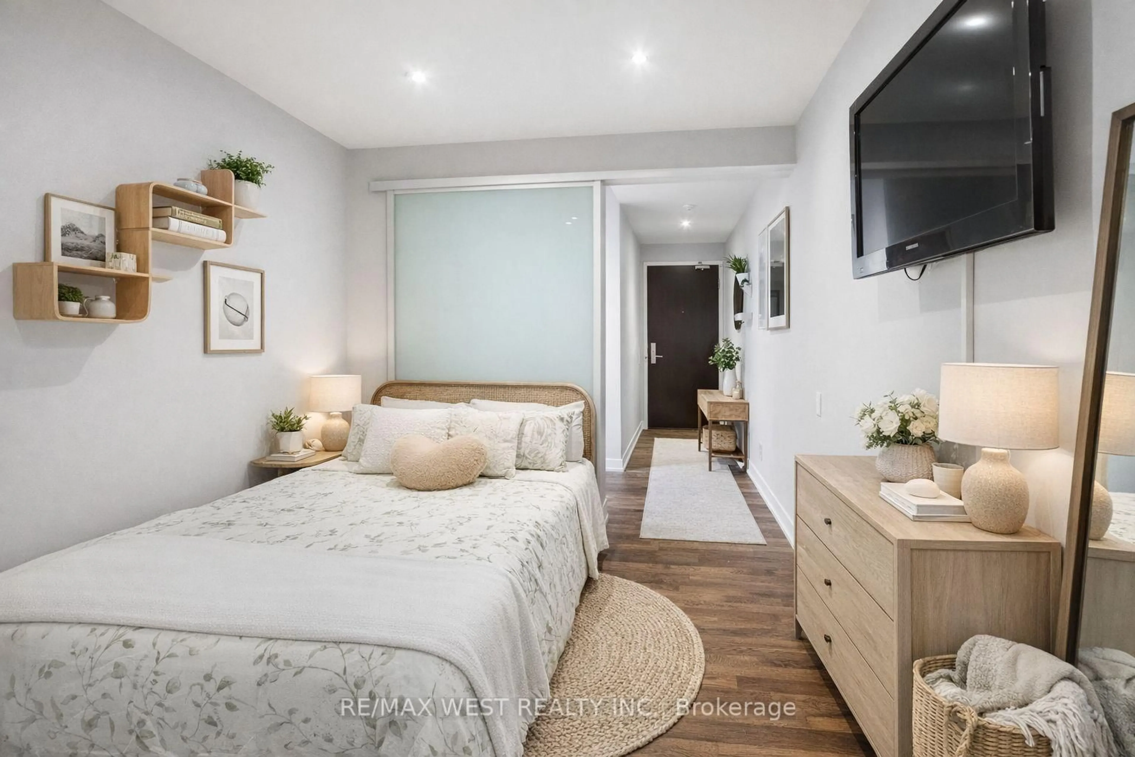 Bedroom with bed, wood/laminate floor for 650 King St #310, Toronto Ontario M5V 0H6