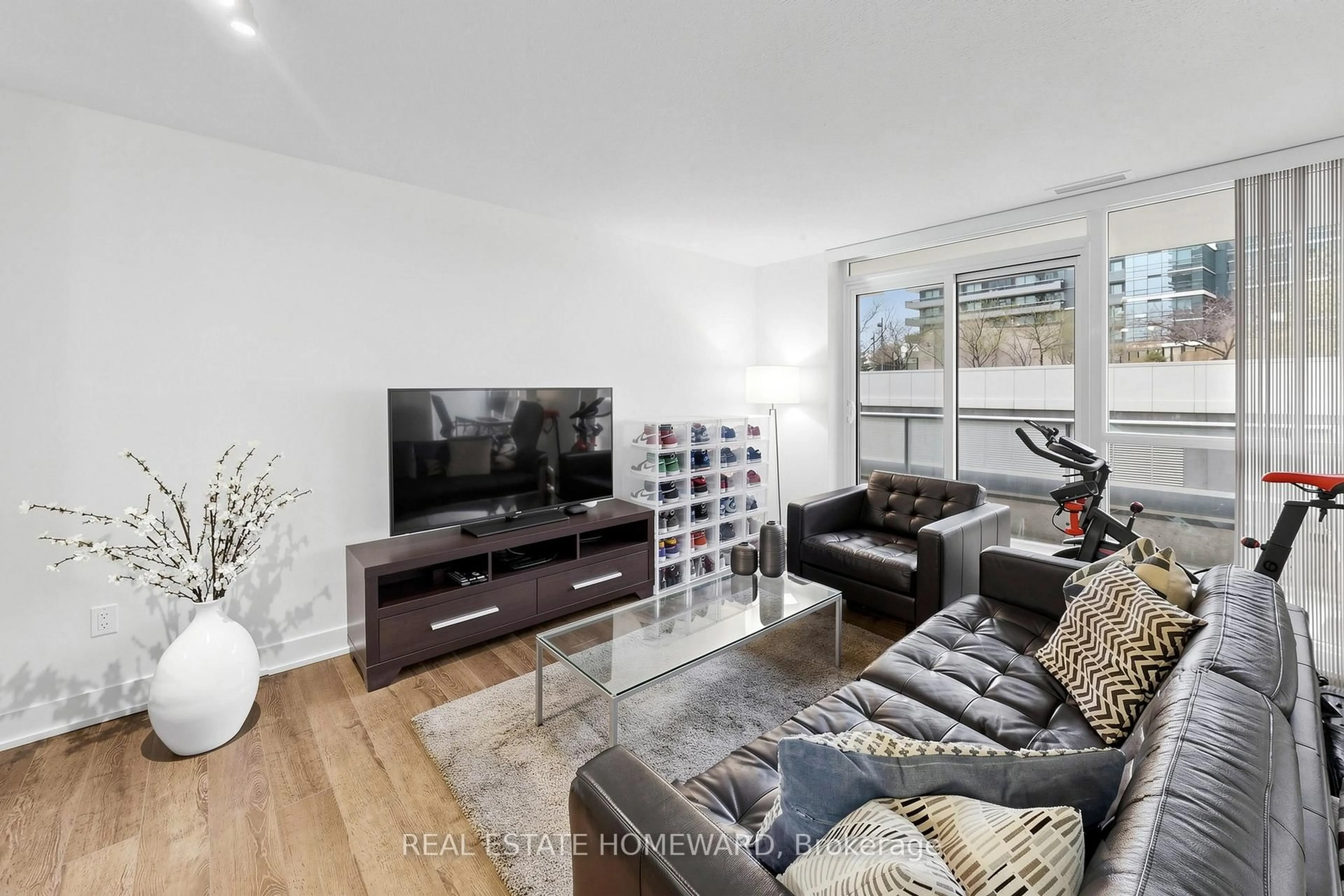 Living room with furniture, wood/laminate floor for 23 Sheppard Ave #402, Toronto Ontario M2N 0C8