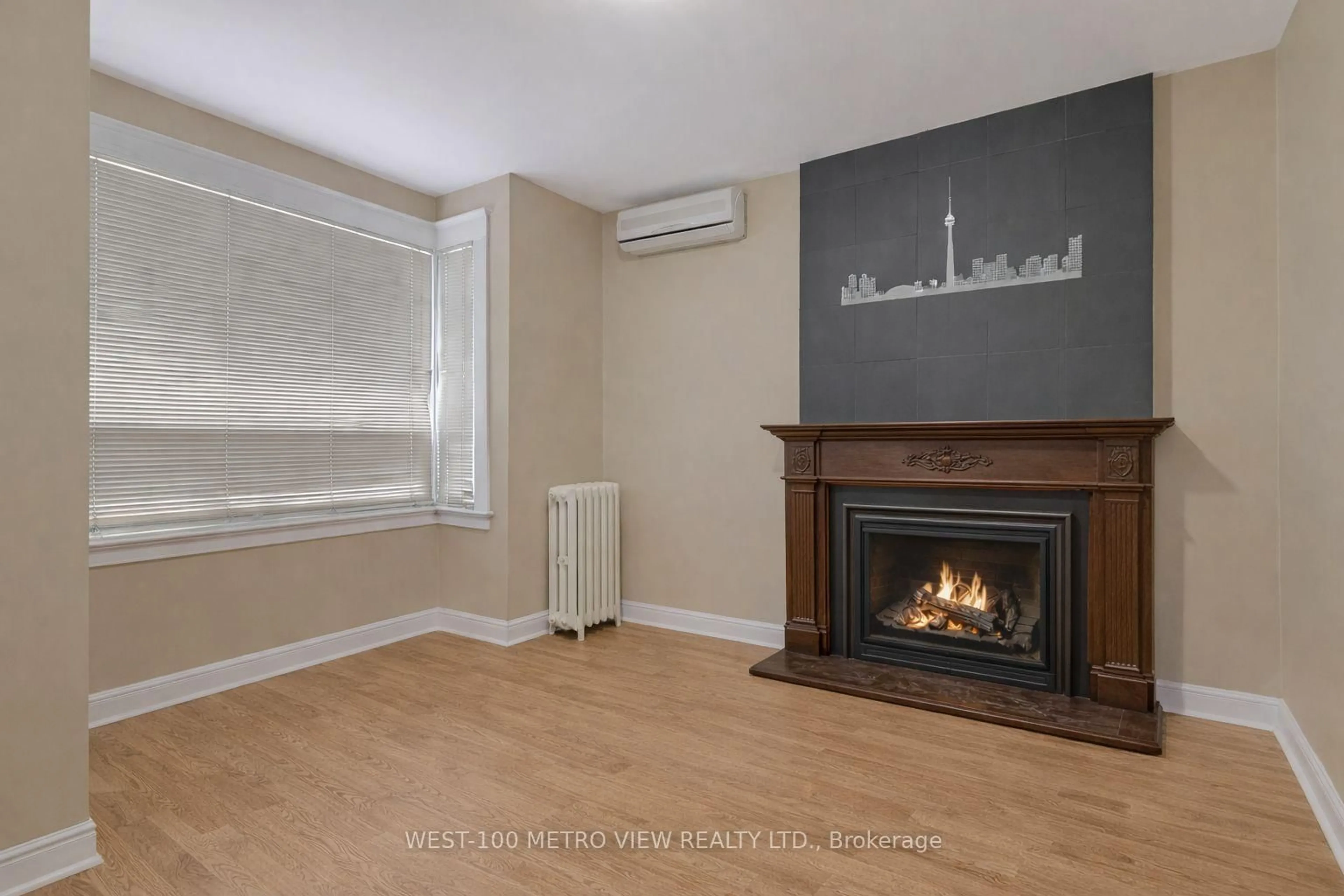 Living room with furniture, wood/laminate floor for 1733 Dufferin St, Toronto Ontario M6E 3N9