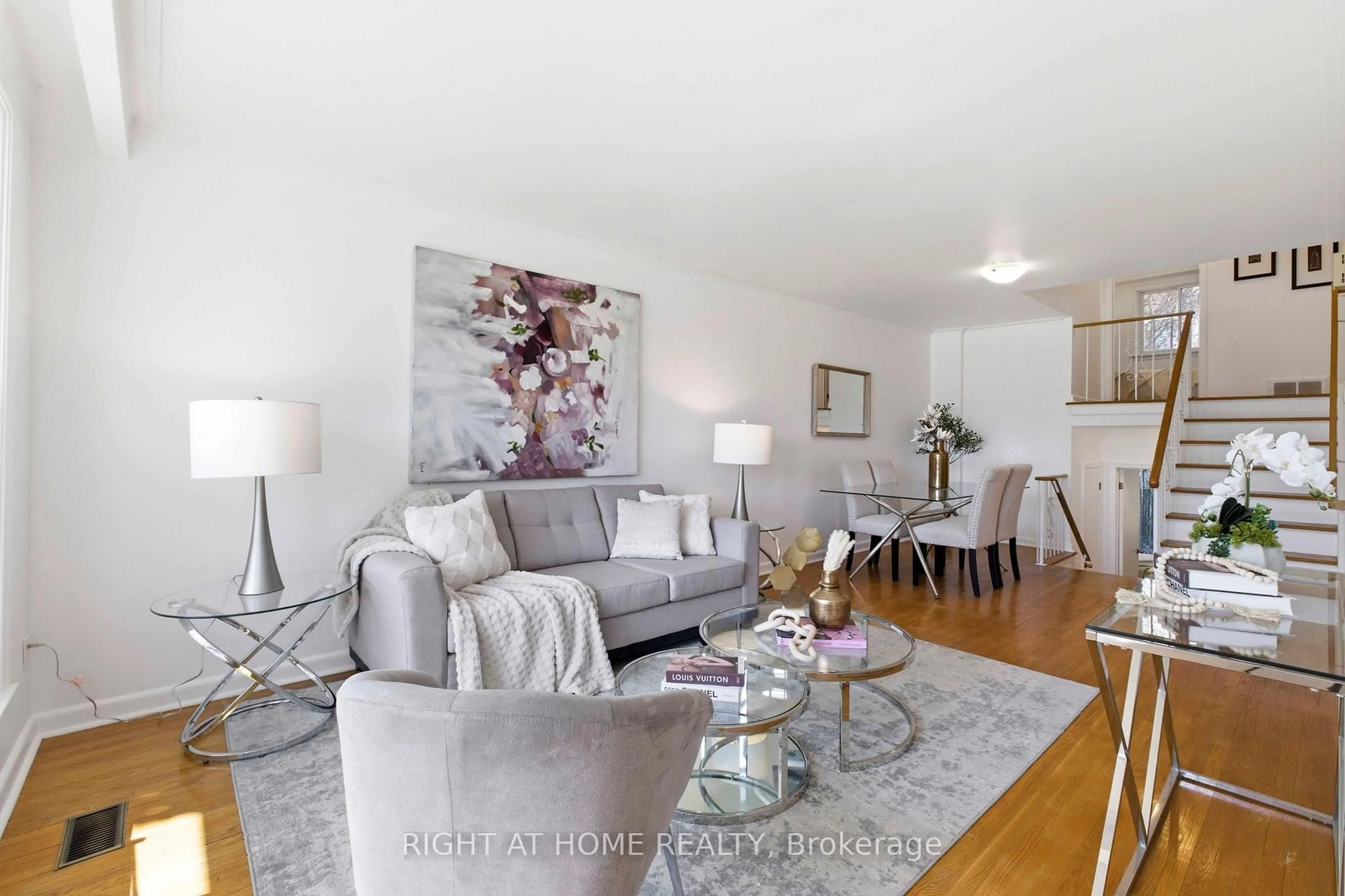 Living room with furniture, wood/laminate floor for 106 Fortrose Cres, Toronto Ontario M3A 2H1