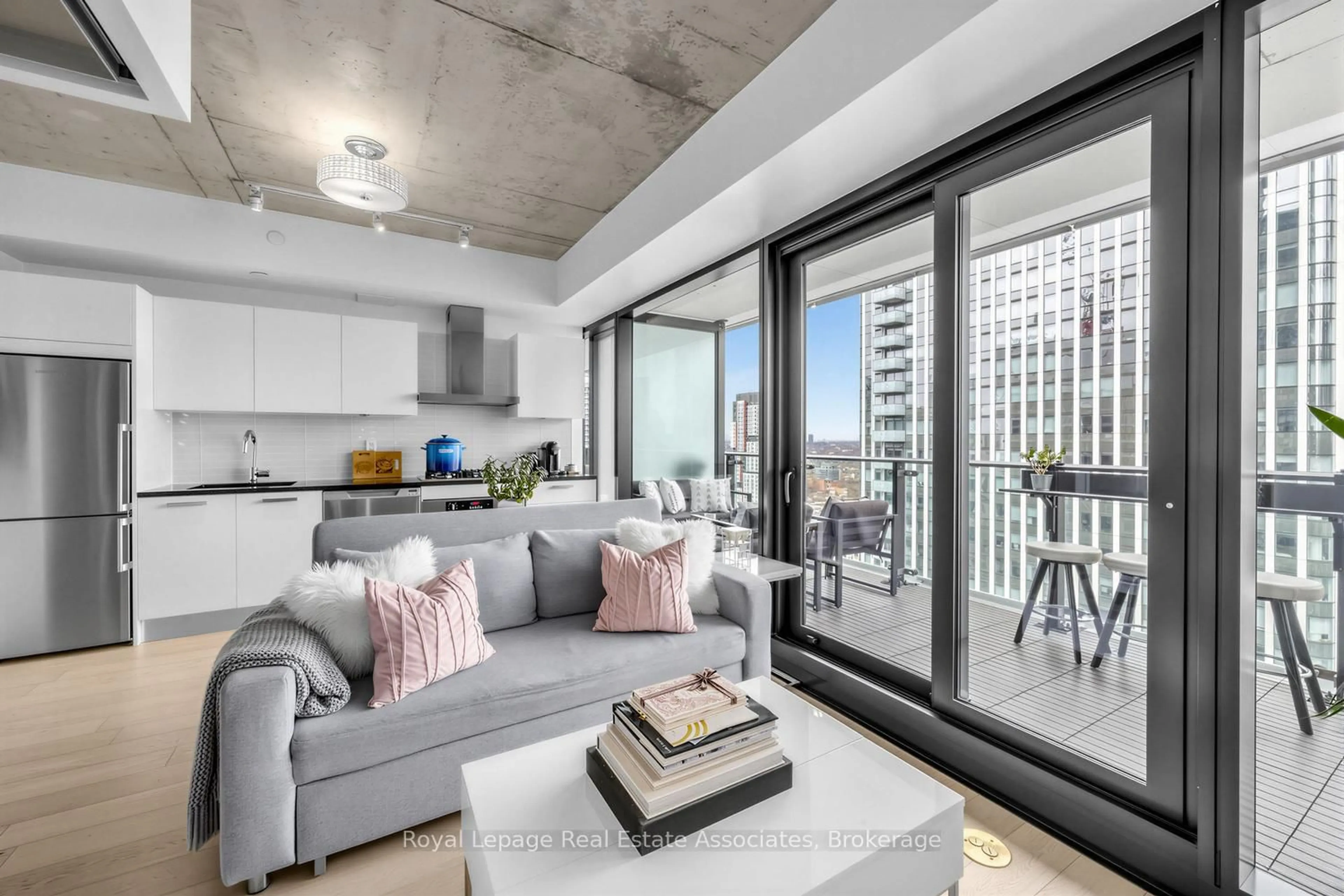 Living room with furniture, cement floor for 224 King St #3102, Toronto Ontario M5H 0A6