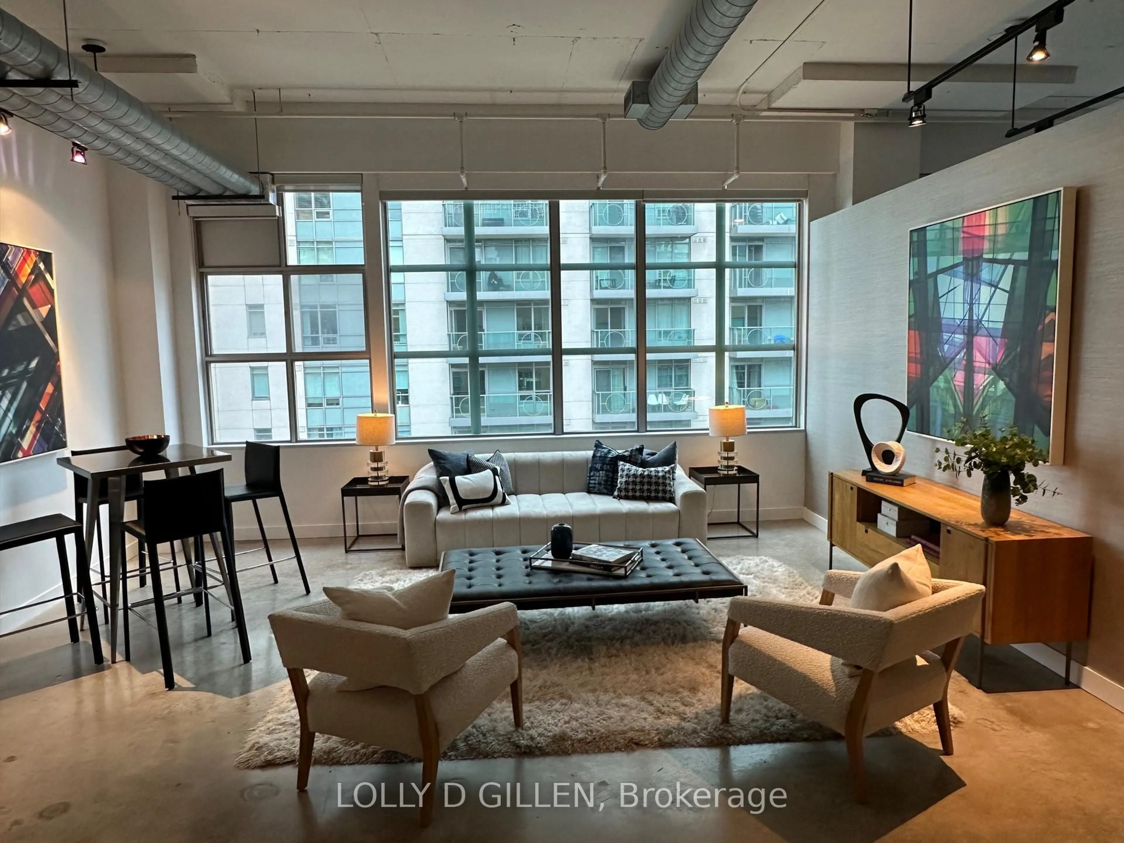 Living room with furniture, cement floor for 188 Eglinton Ave #PH07, Toronto Ontario M4P 2X7