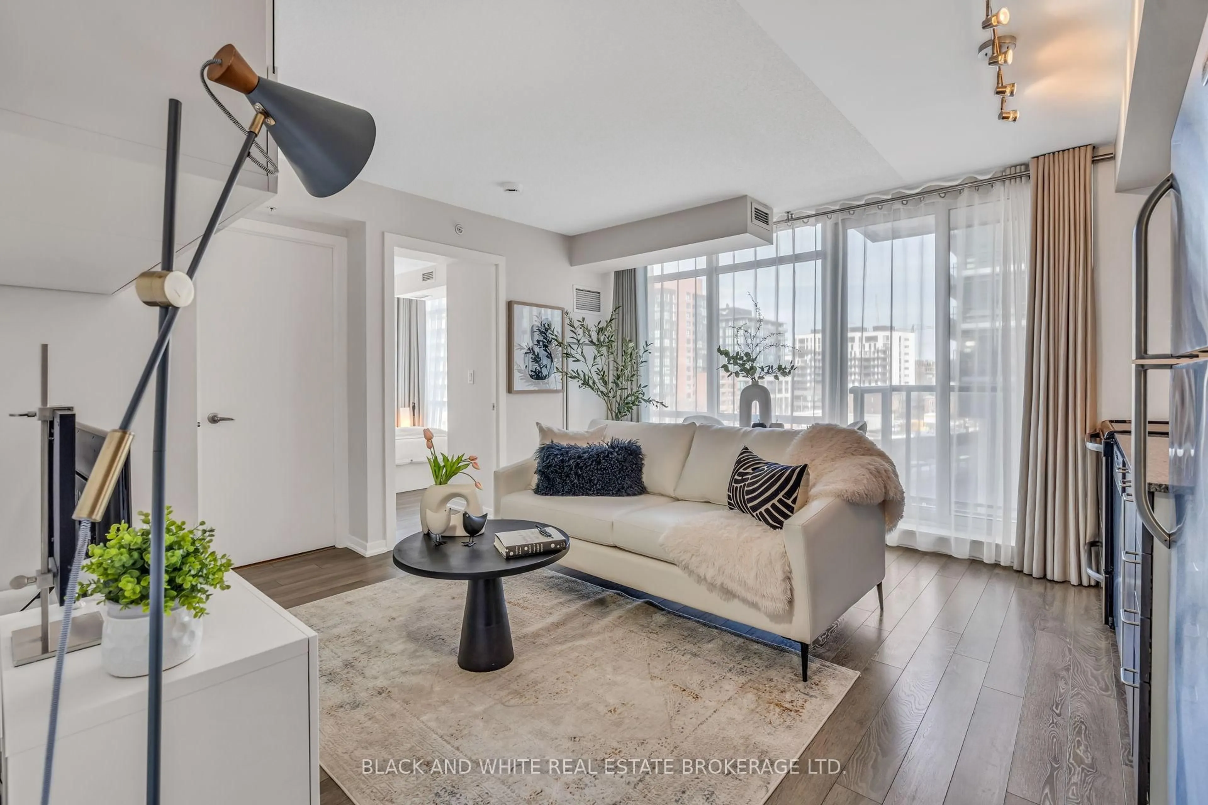 Living room with furniture, unknown for 20 Joe Shuster Way #403, Toronto Ontario M6K 0A3