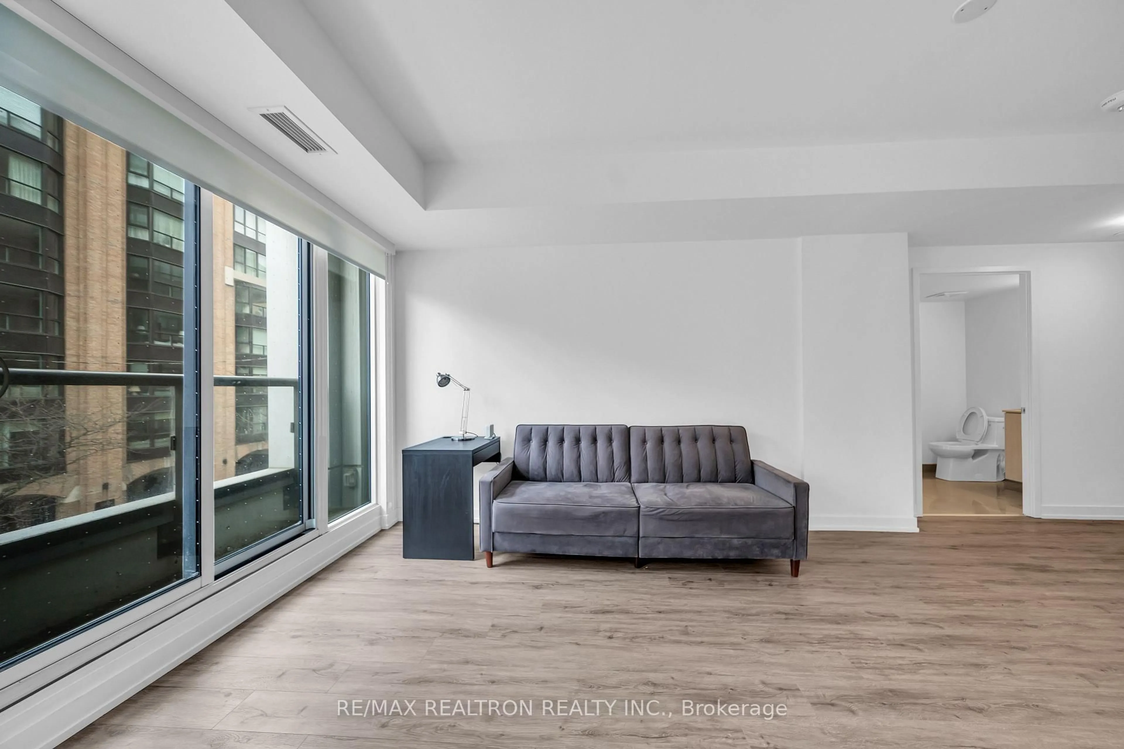 Living room with furniture, unknown for 158 Front St #203, Toronto Ontario M5A 0K9