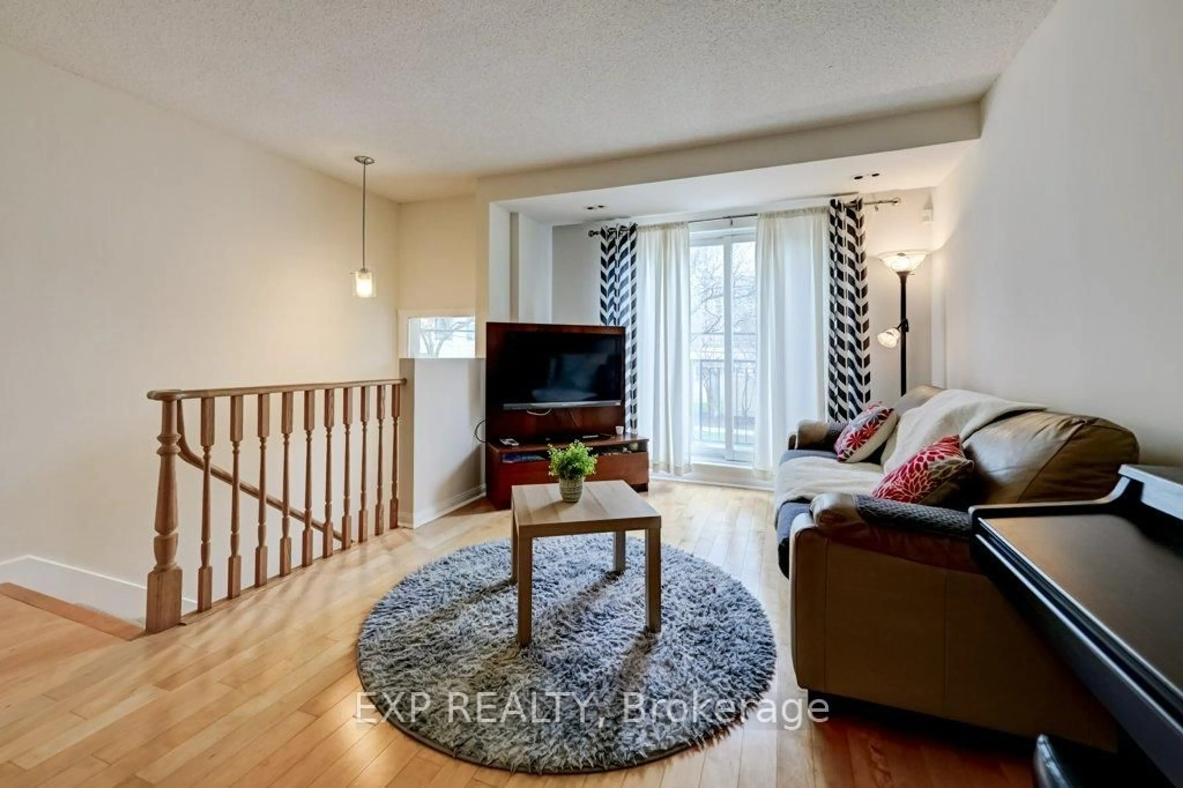 Living room with furniture, wood/laminate floor for 28 Sommerset Way #1716, Toronto Ontario M2N 6W7