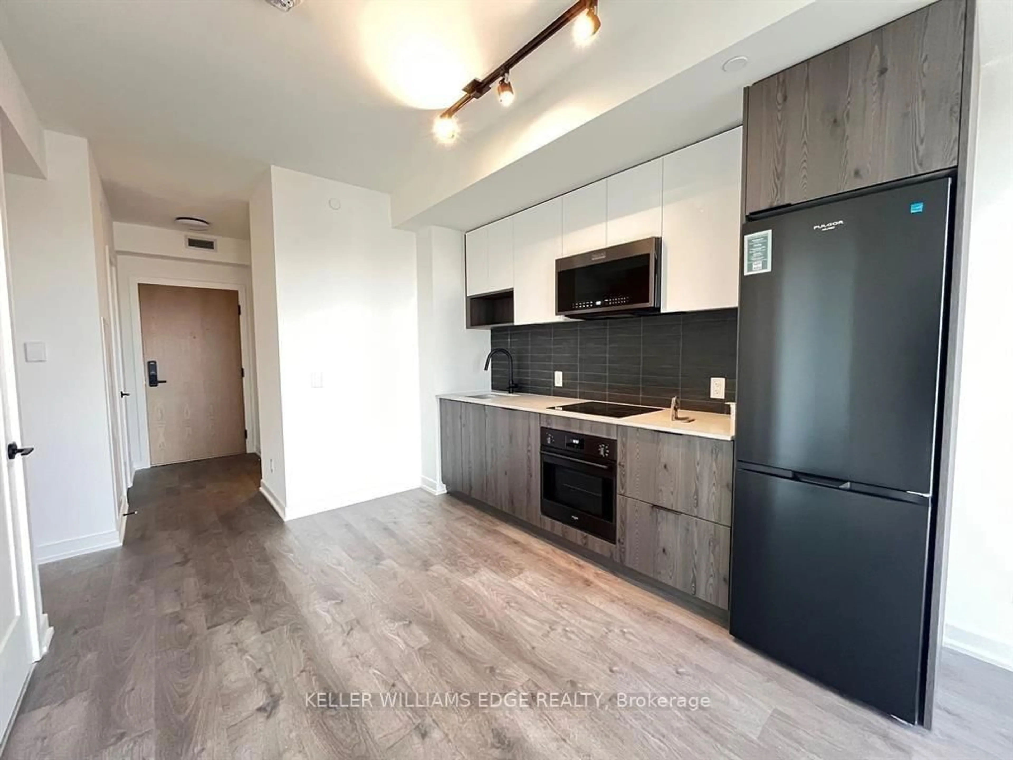 Open concept kitchen, wood/laminate floor for 5 Defries St #3010, Toronto Ontario M5A 3R4
