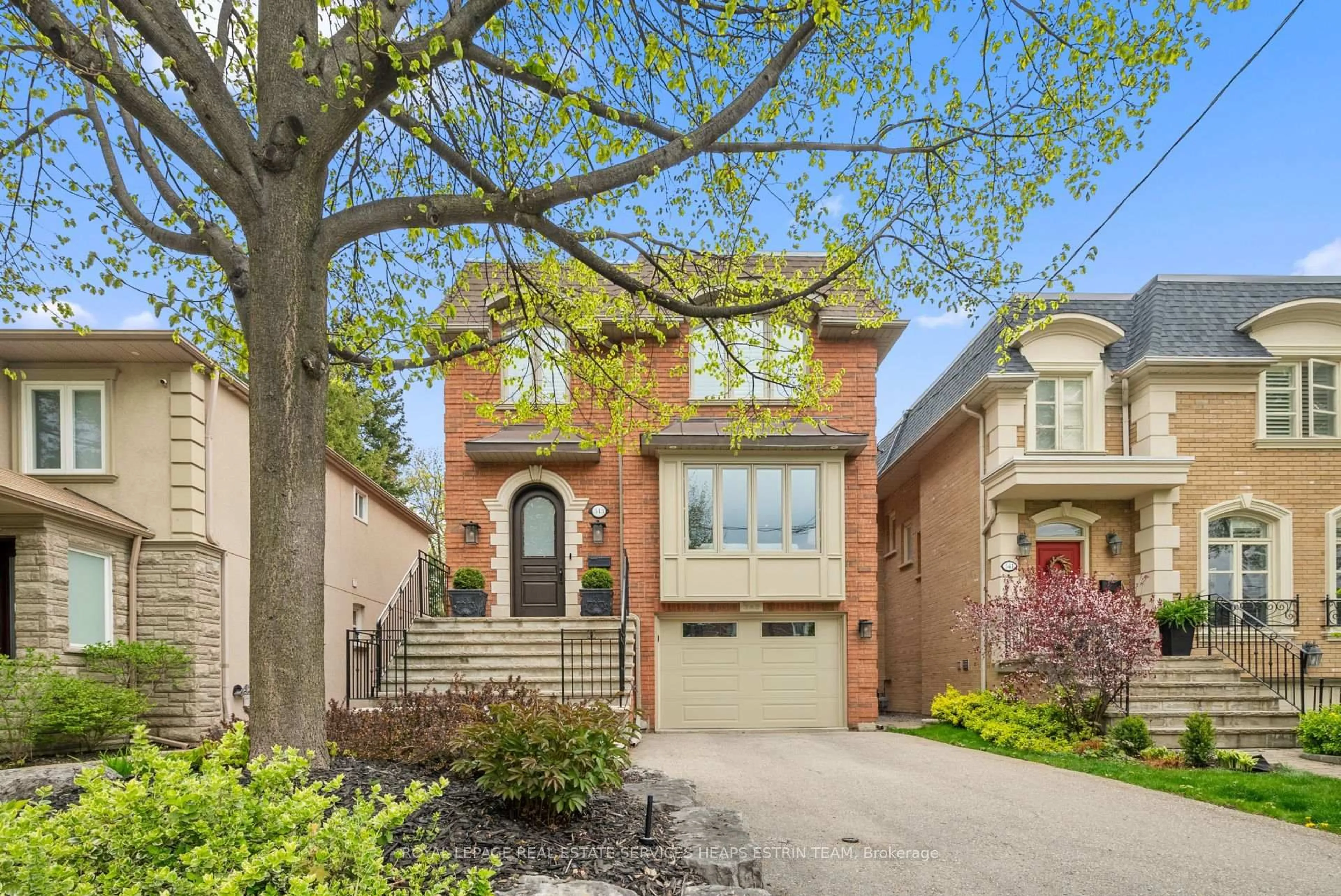 Home with brick exterior material, street for 343 Laird Dr, Toronto Ontario M4G 3Y1