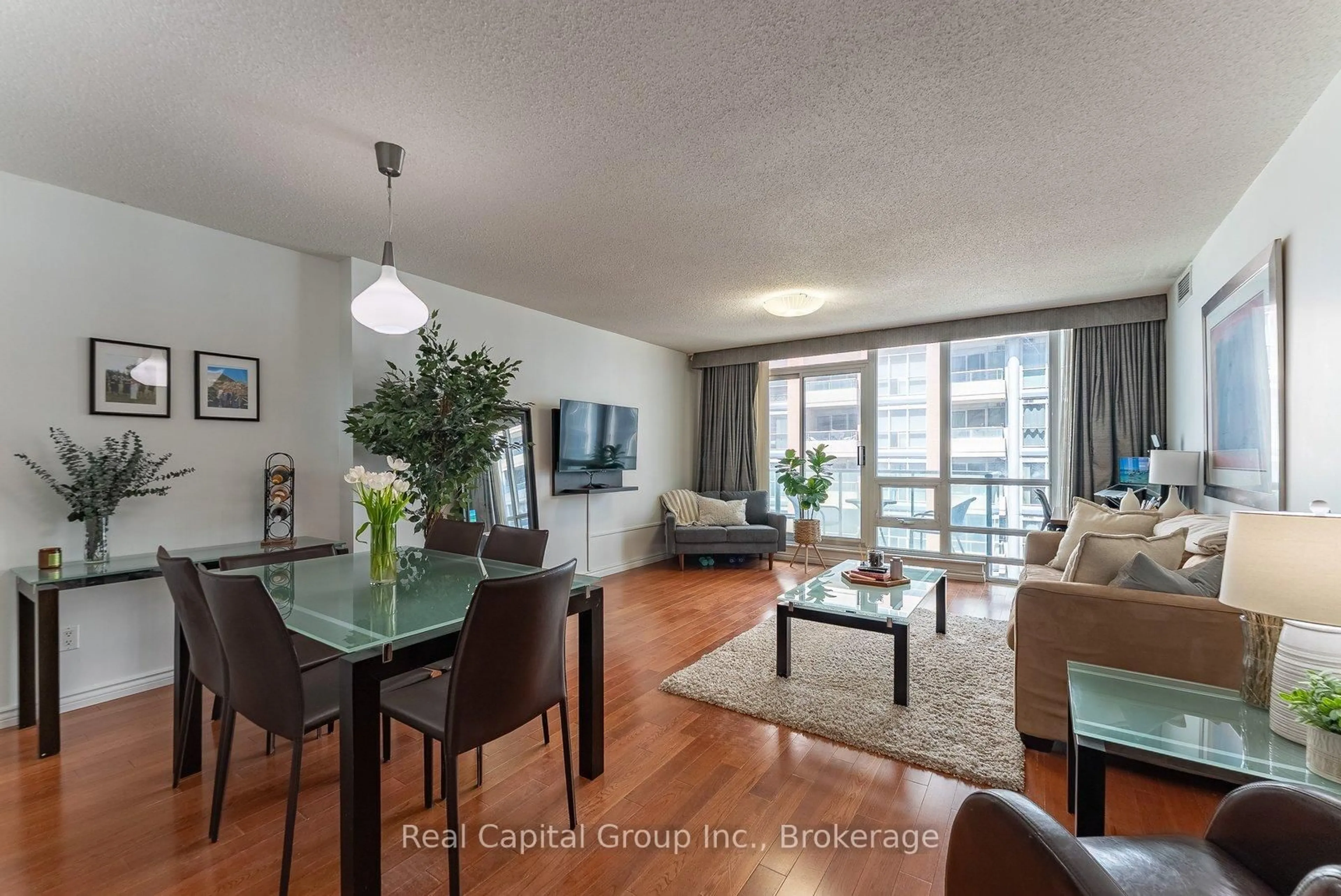 Living room with furniture, wood/laminate floor for 263 Wellington St #703, Toronto Ontario M5V 3E6