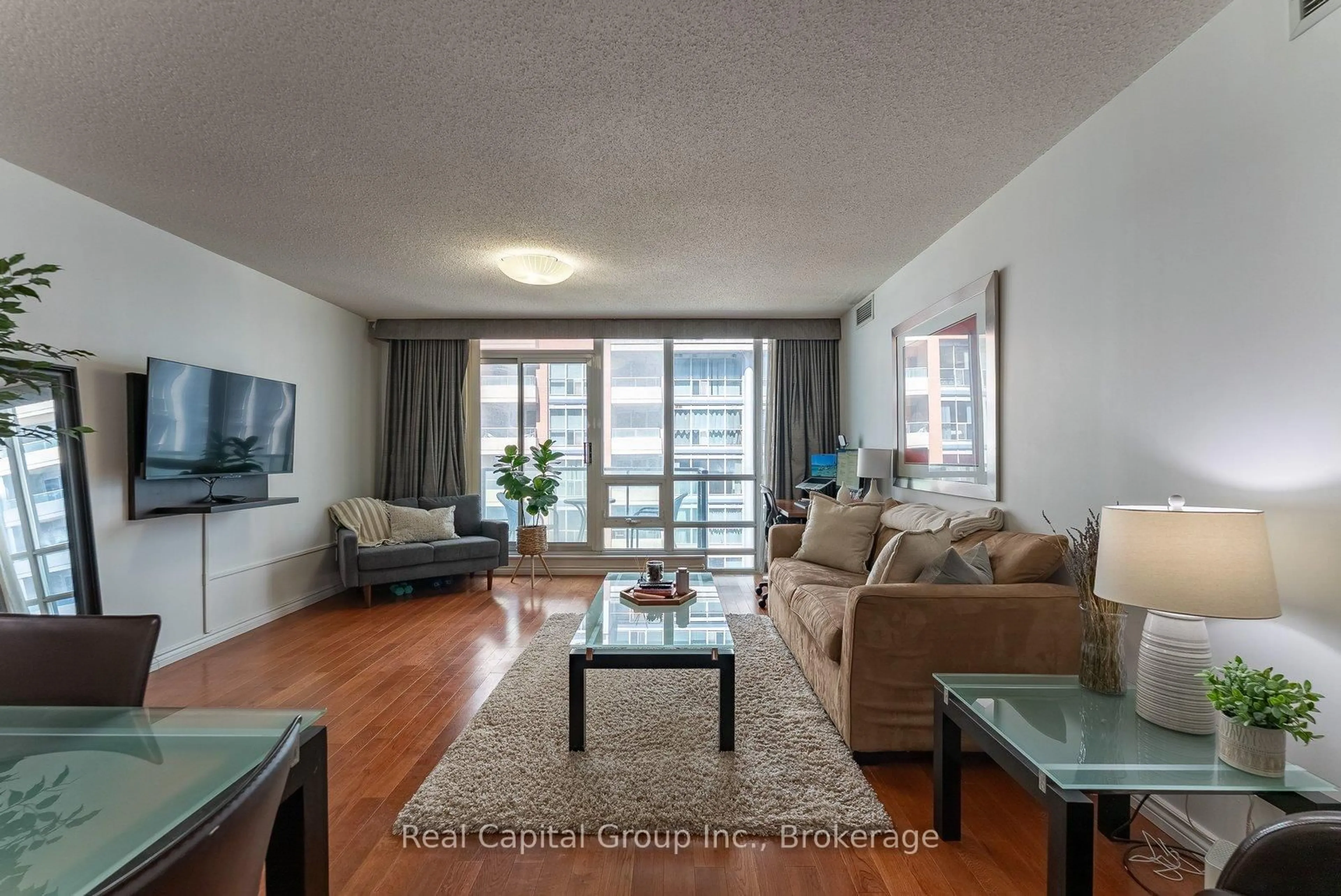 Living room with furniture, wood/laminate floor for 263 Wellington St #703, Toronto Ontario M5V 3E6