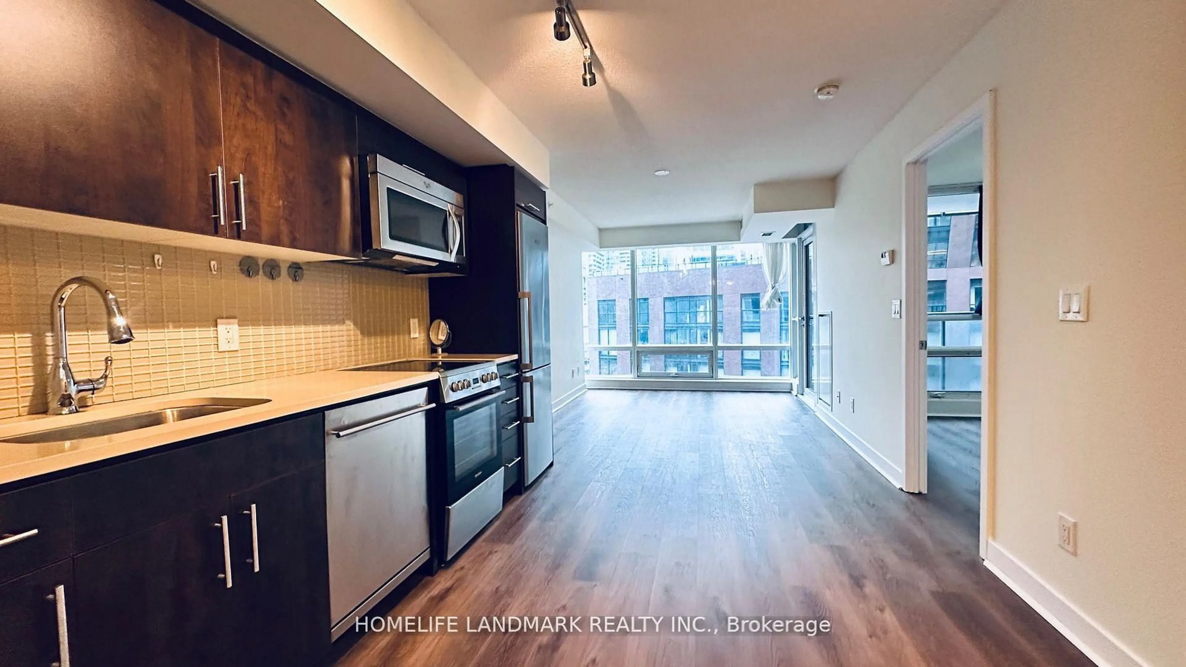 Open concept kitchen, wood/laminate floor for 295 Adelaide St #605, Toronto Ontario M5V 0L4