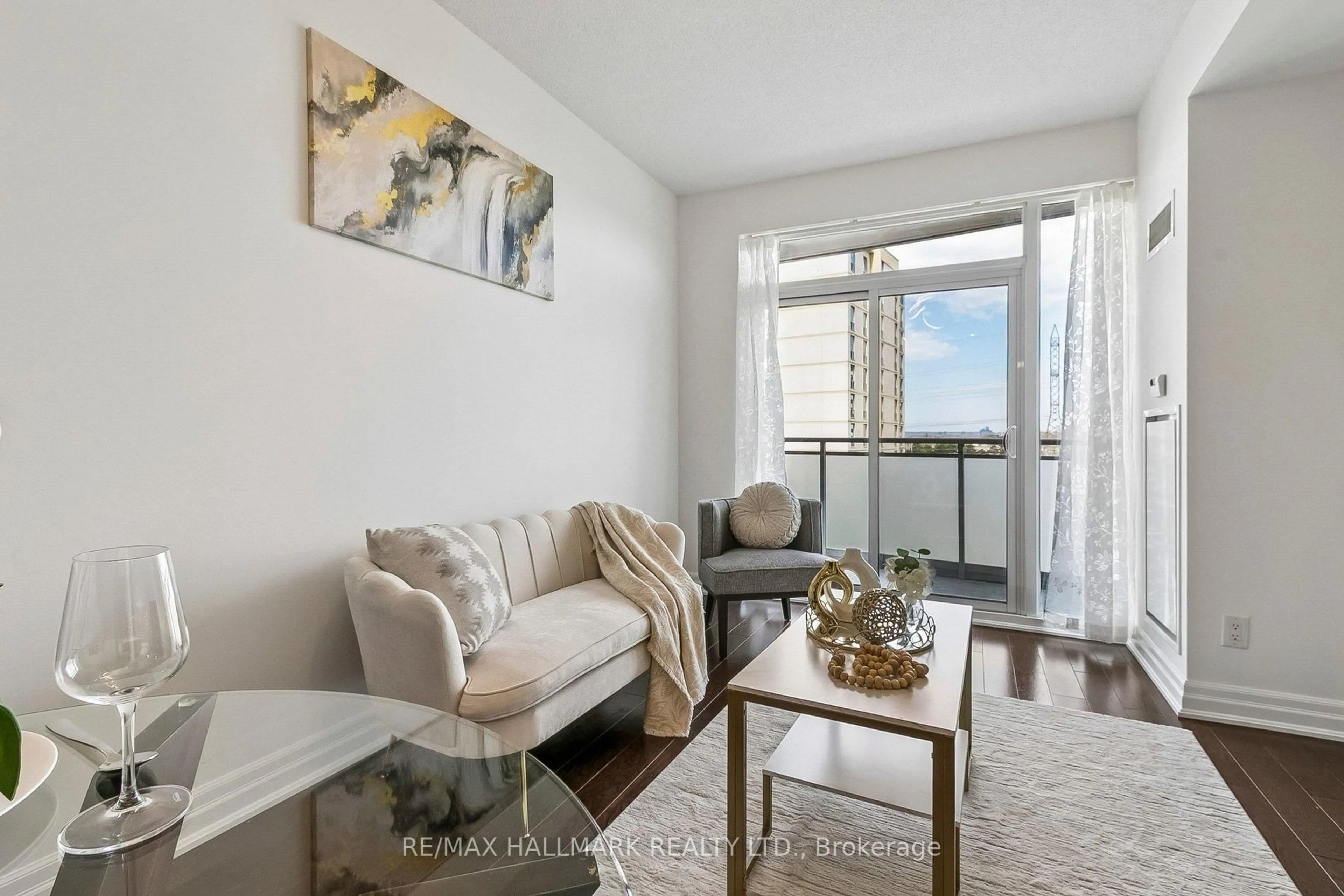 Living room with furniture, wood/laminate floor for 17 Ruddington Dr #705, Toronto Ontario M2K 0A8