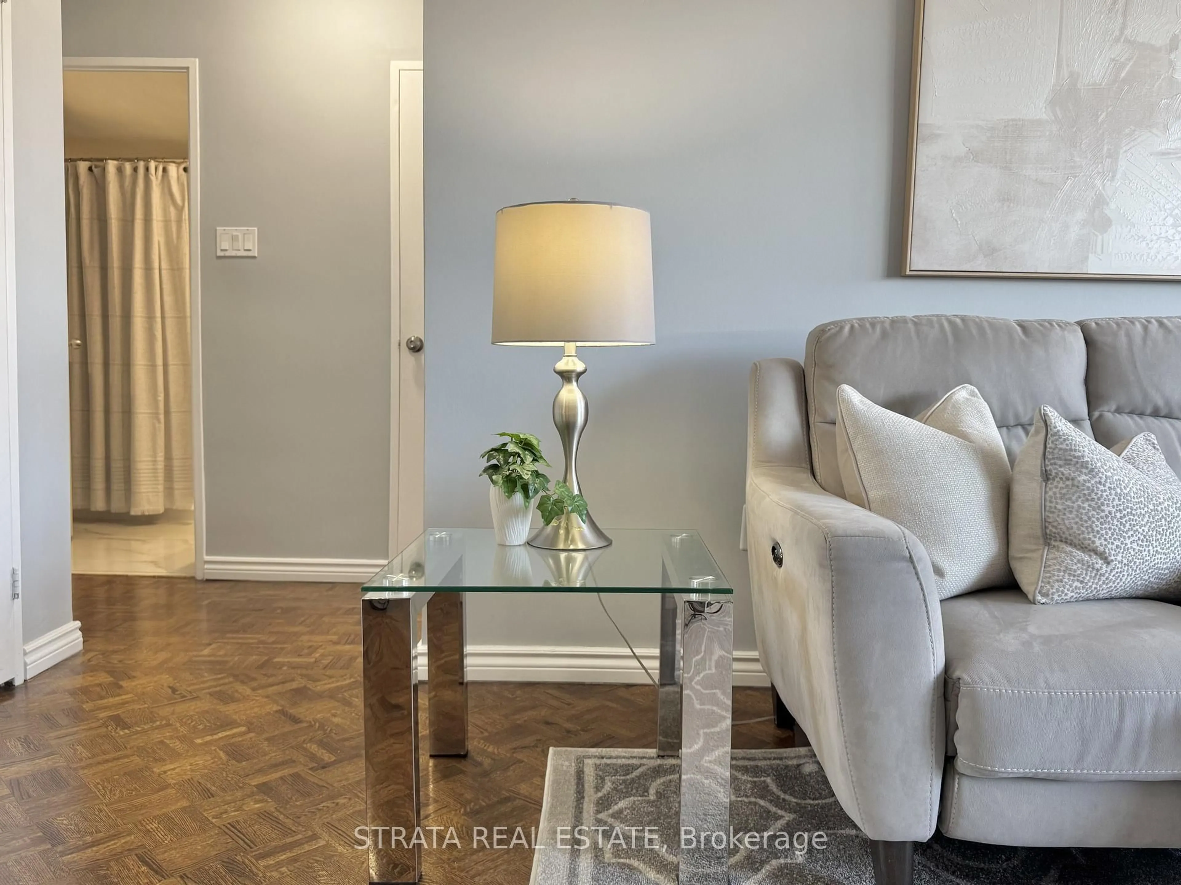 Living room with furniture, wood/laminate floor for 3555 Bathurst St #203, Toronto Ontario M6A 2Y8