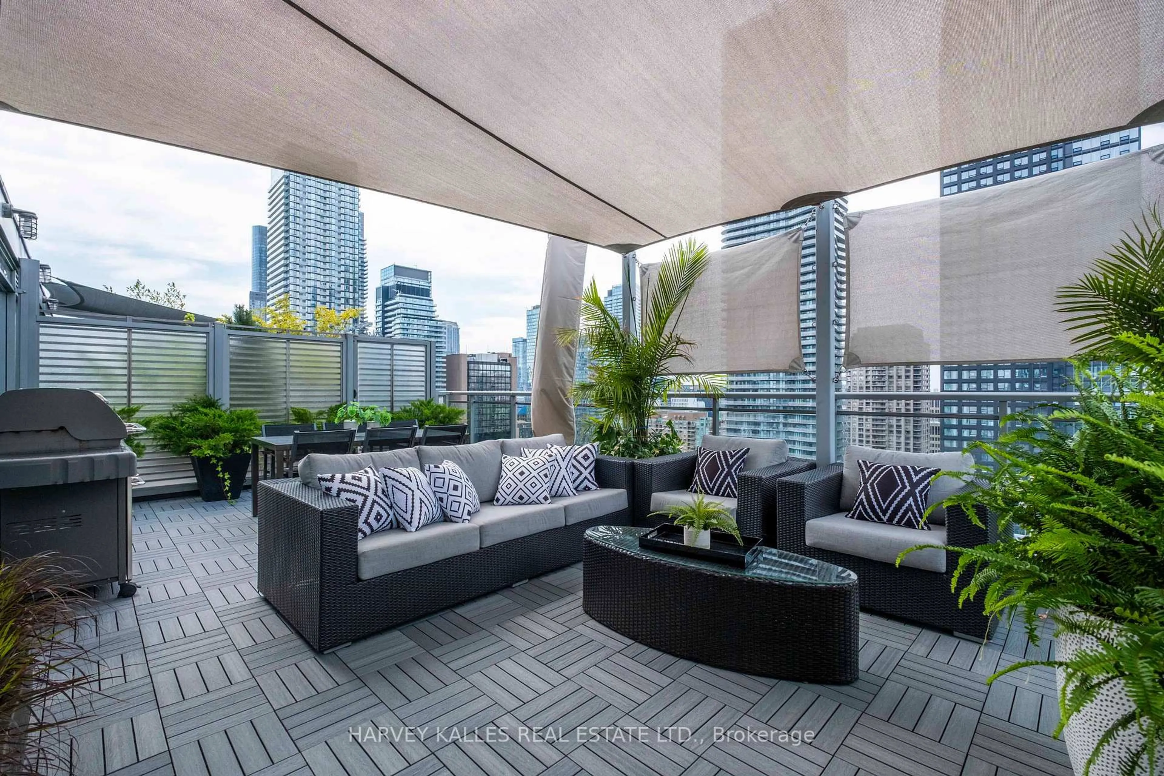 Patio, city buildings view from balcony for 22 Wellesley St #PH2, Toronto Ontario M4Y 1G3