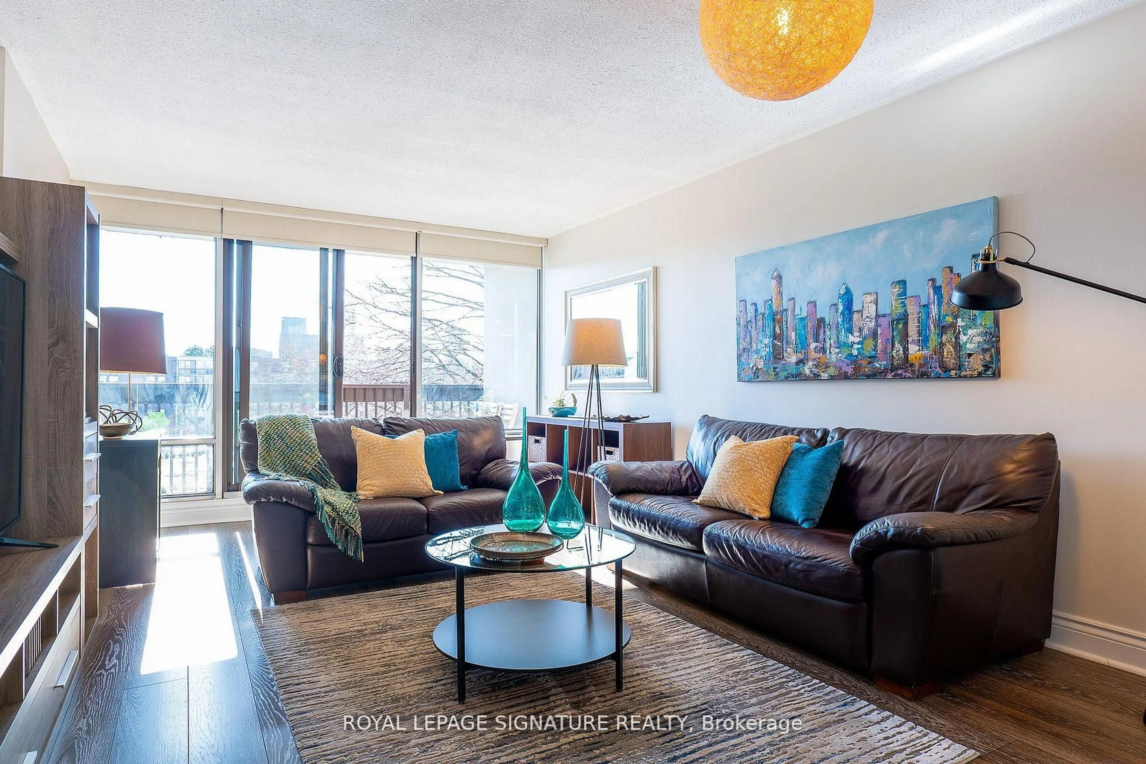 Living room with furniture, wood/laminate floor for 30 Fashion Roseway #404, Toronto Ontario M2N 6B4