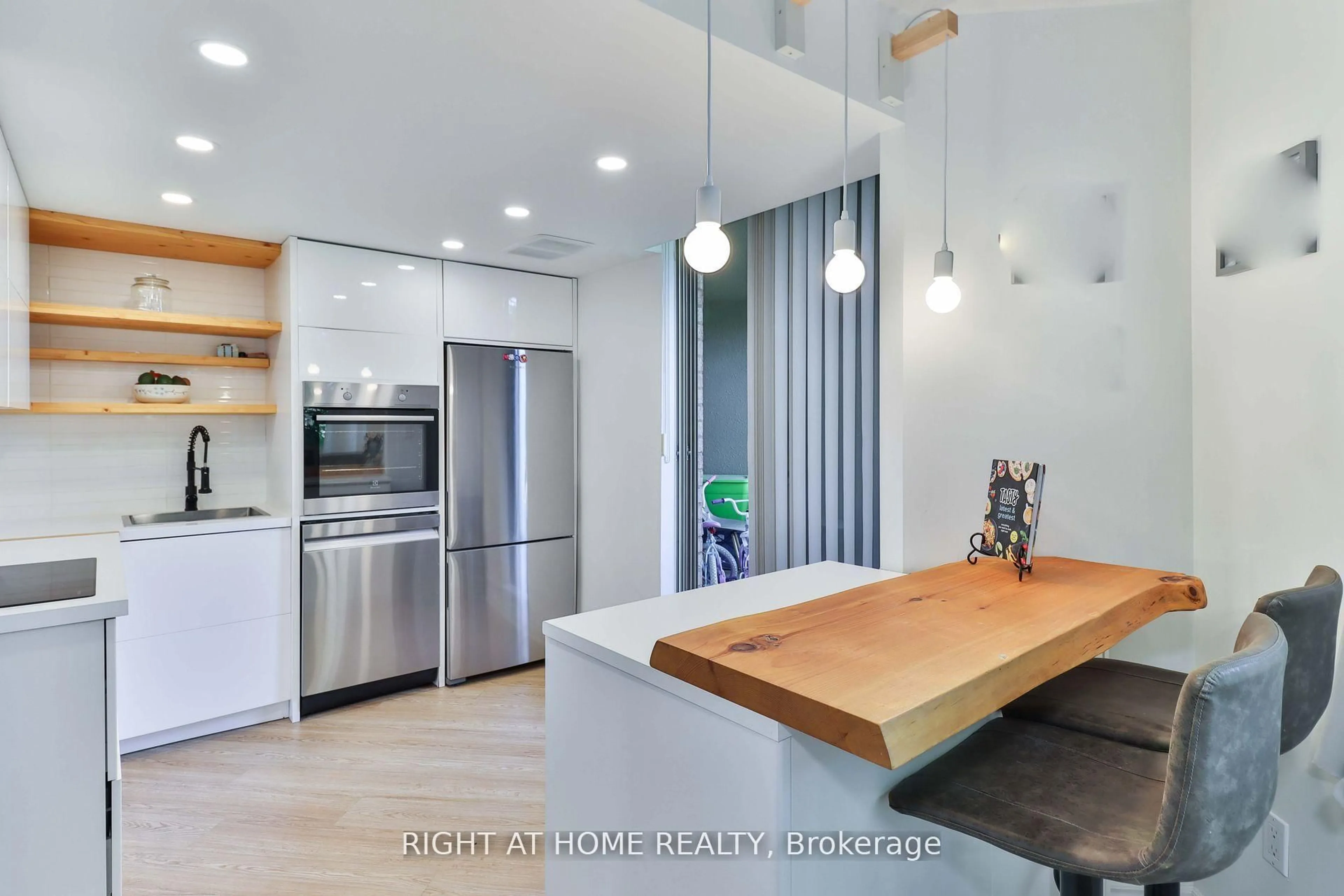 Contemporary kitchen, wood/laminate floor for 1210 Don Mills Rd, Toronto Ontario M3B 3N9