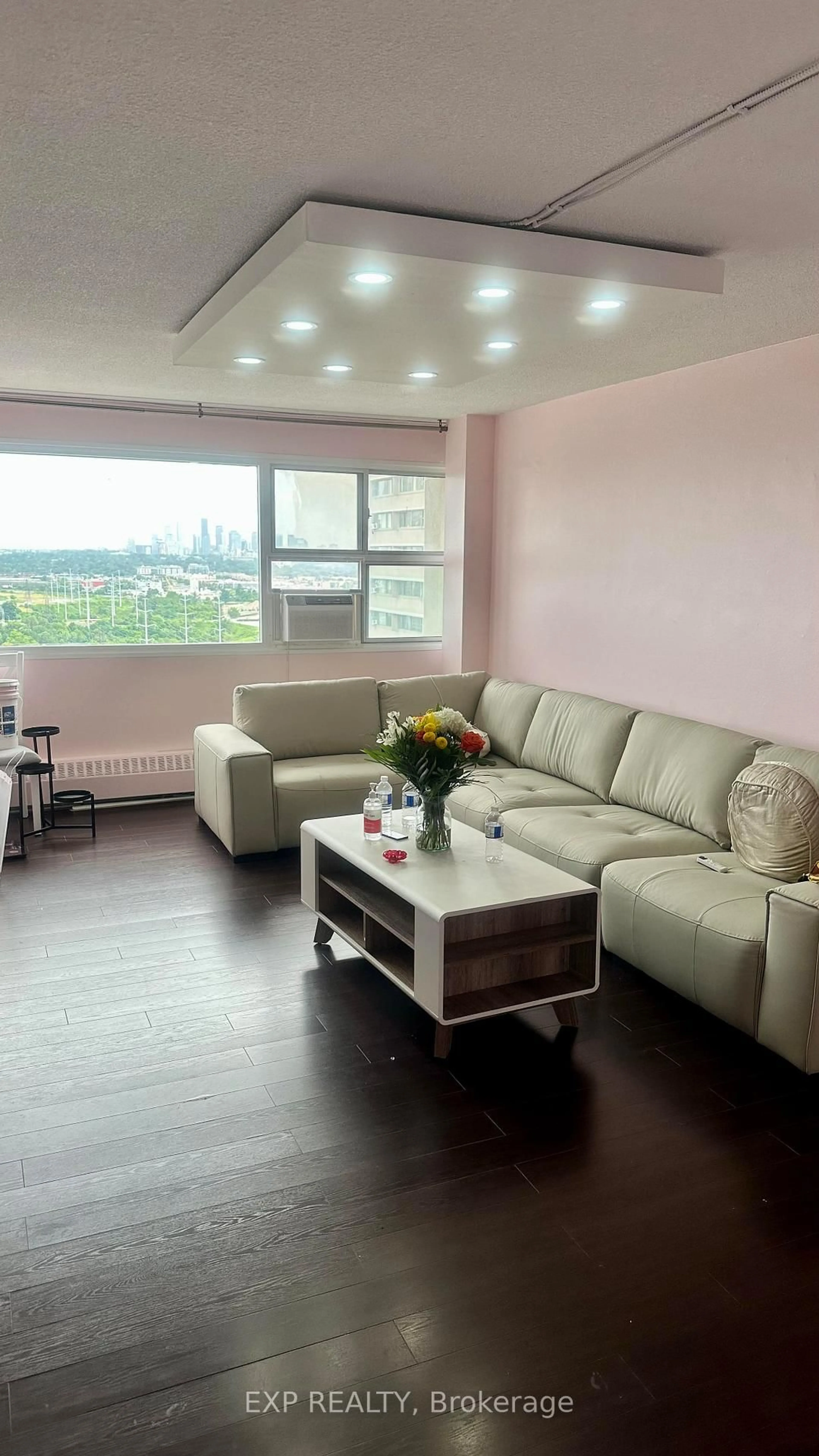 Living room with furniture, wood/laminate floor for 725 Donmills Rd #2506, Toronto Ontario M3C 1S8