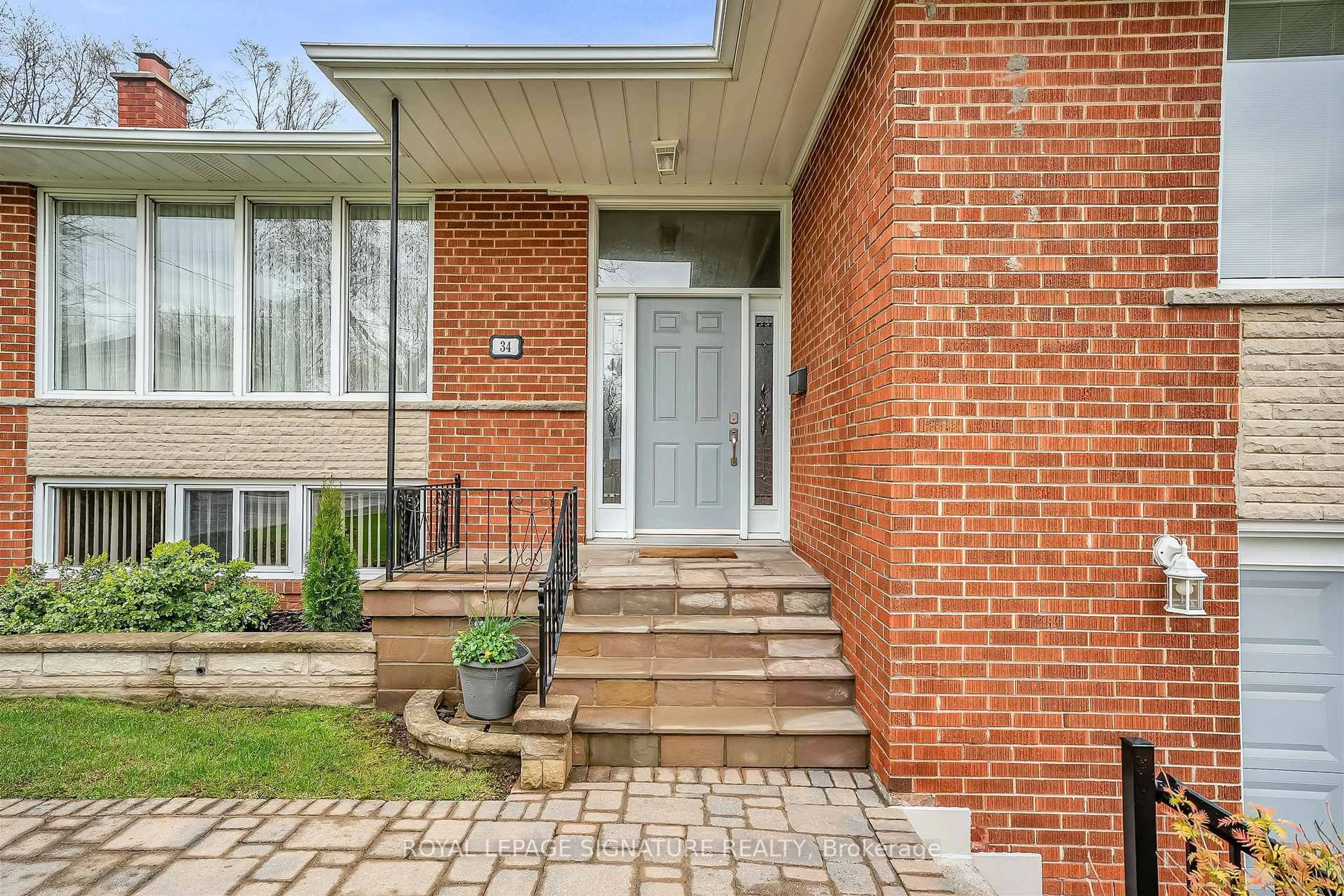 Home with brick exterior material, street for 34 Tufton Cres, Toronto Ontario M4A 2E3