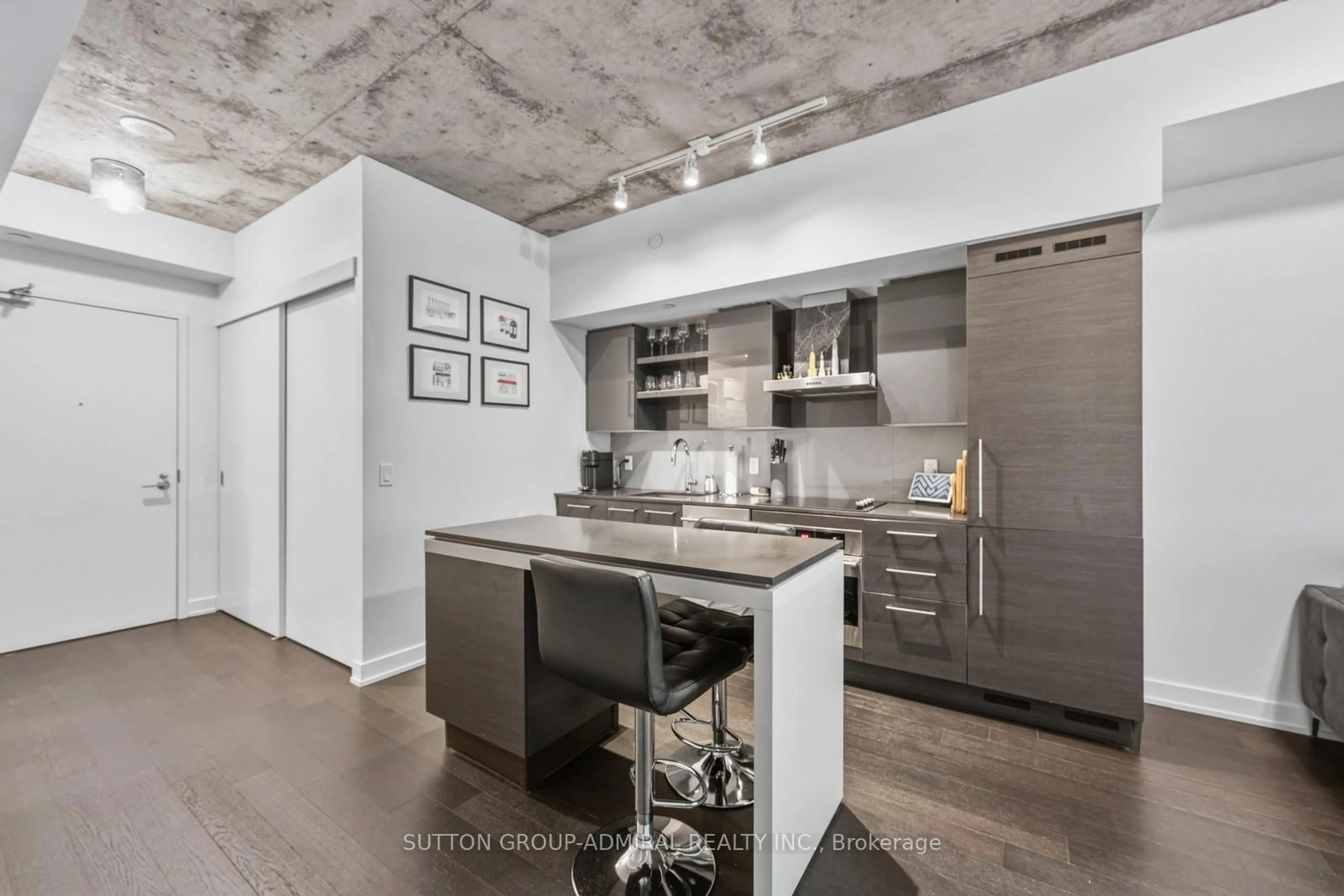 Open concept kitchen, cement floor for 1030 King St #921, Toronto Ontario M6K 0B4