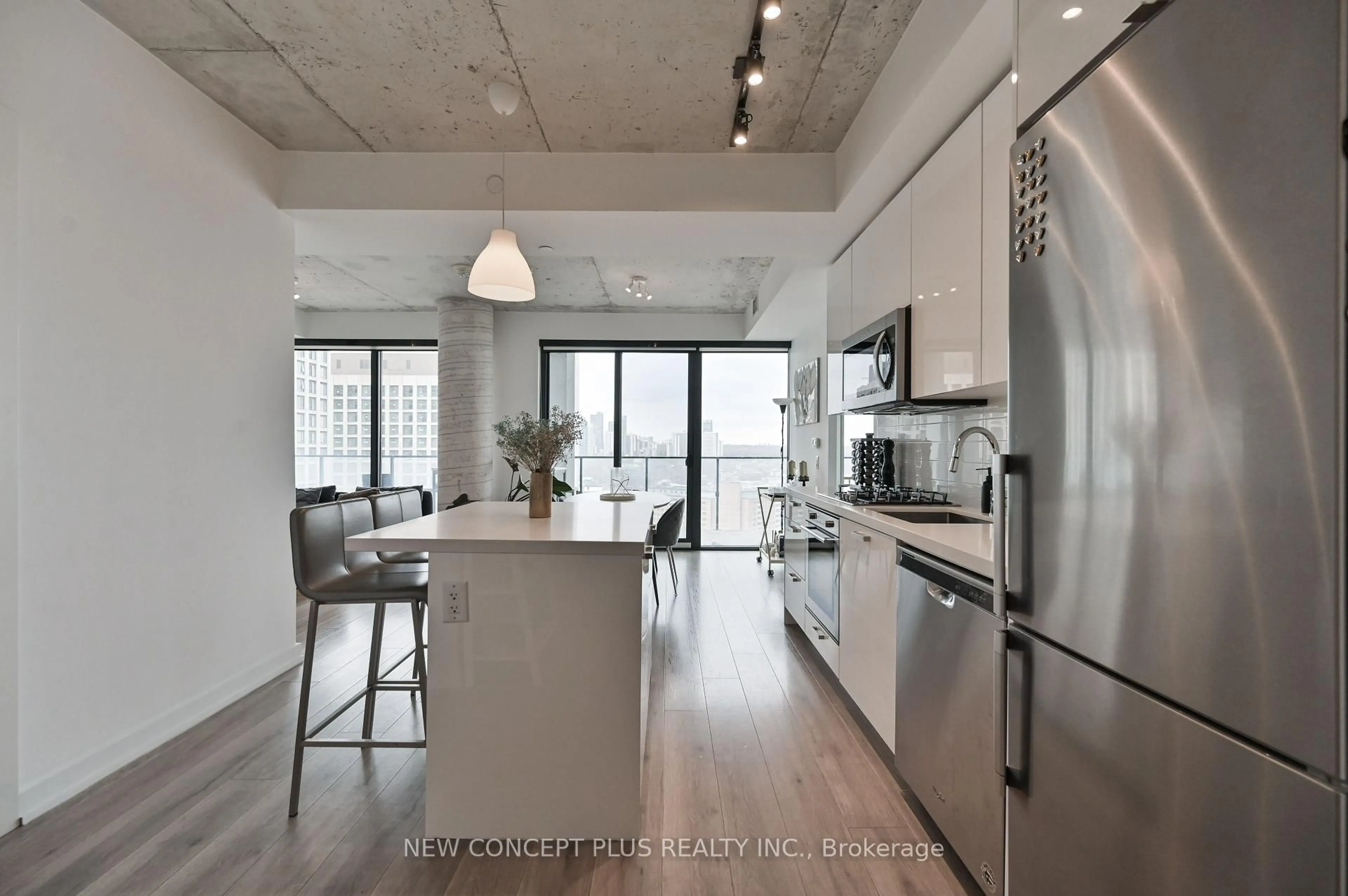 Open concept kitchen, cement floor for 55 Ontario St #2301, Toronto Ontario M5A 0T8