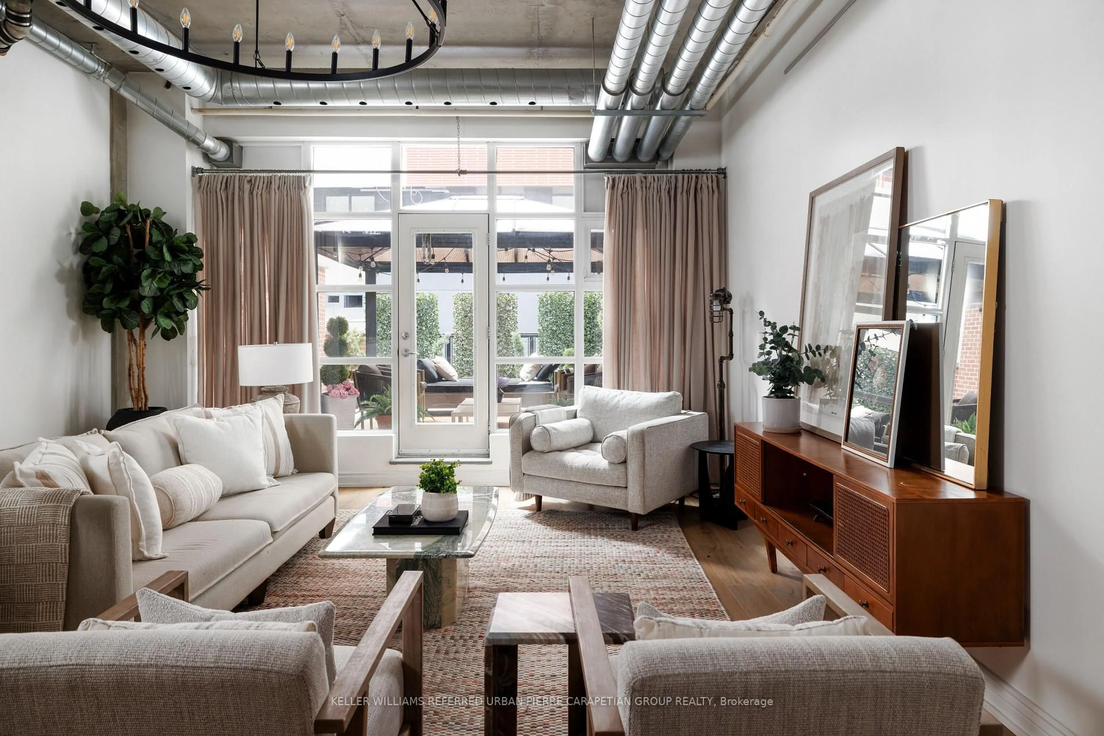 Living room with furniture, cement floor for 261 King St #205, Toronto Ontario M5A 4T6