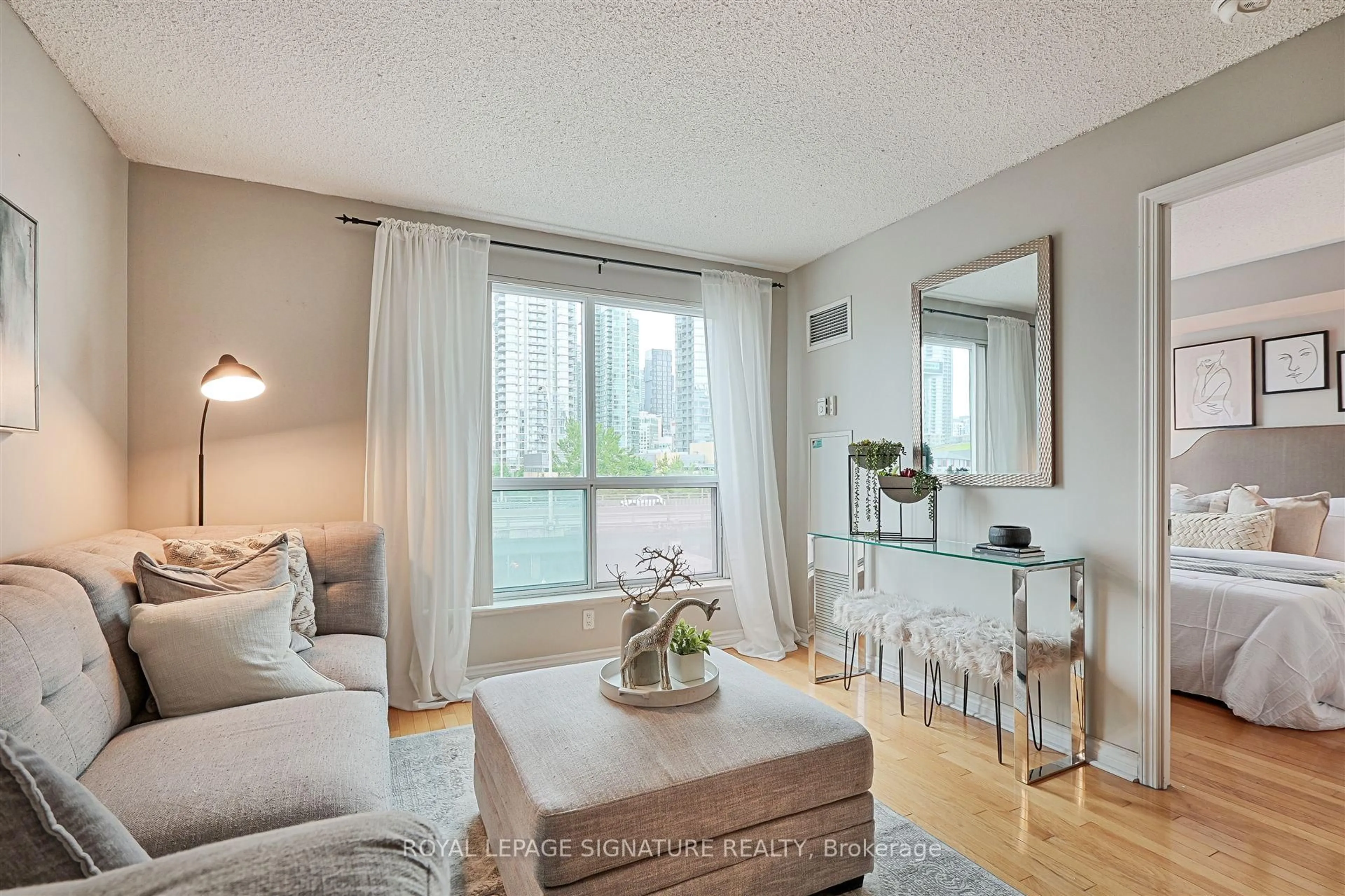 Living room with furniture, wood/laminate floor for 410 Queens Quay #505, Toronto Ontario M5V 3T1