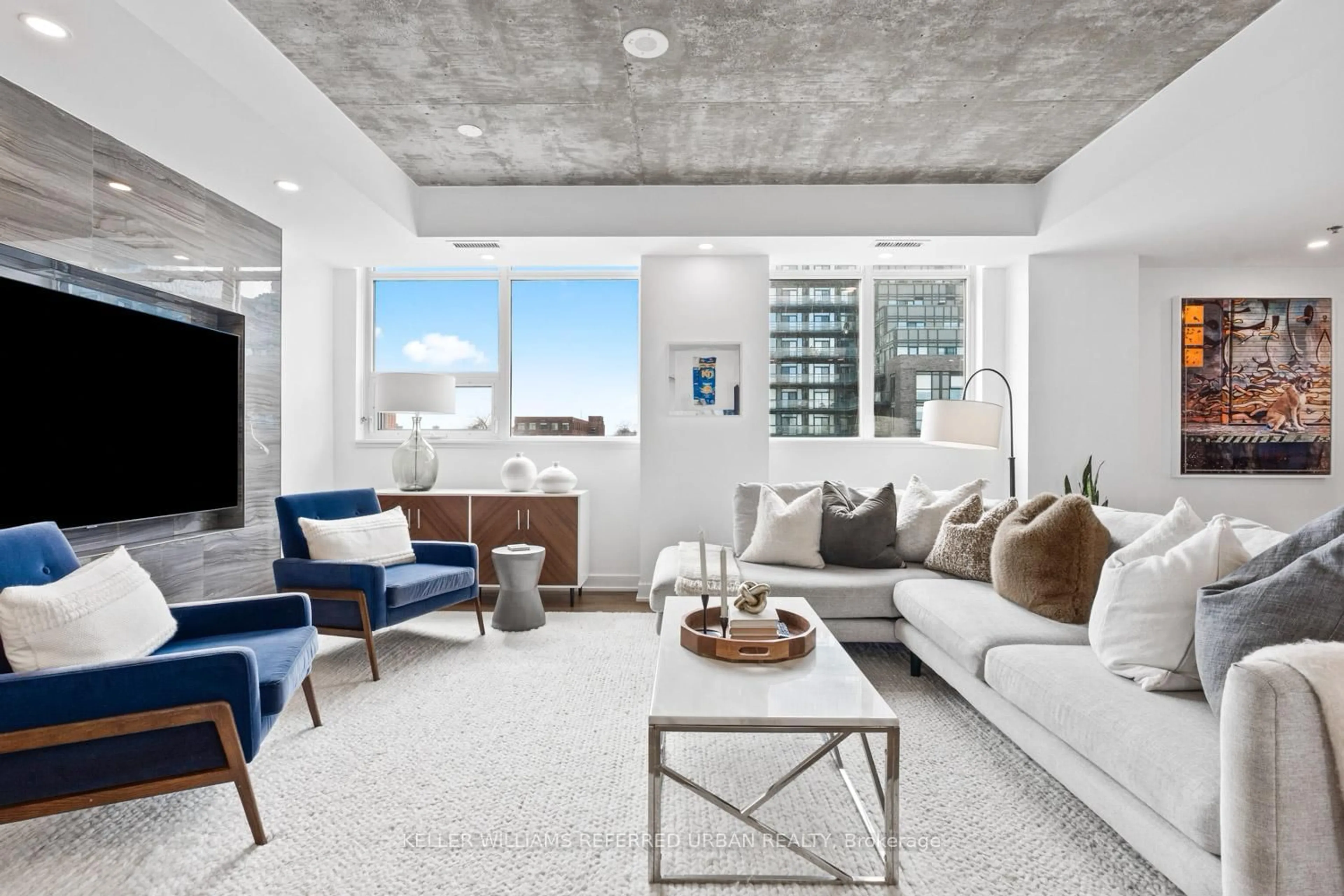 Living room with furniture, cement floor for 20 Minowan Miikan Lane #422, Toronto Ontario M6J 0E5