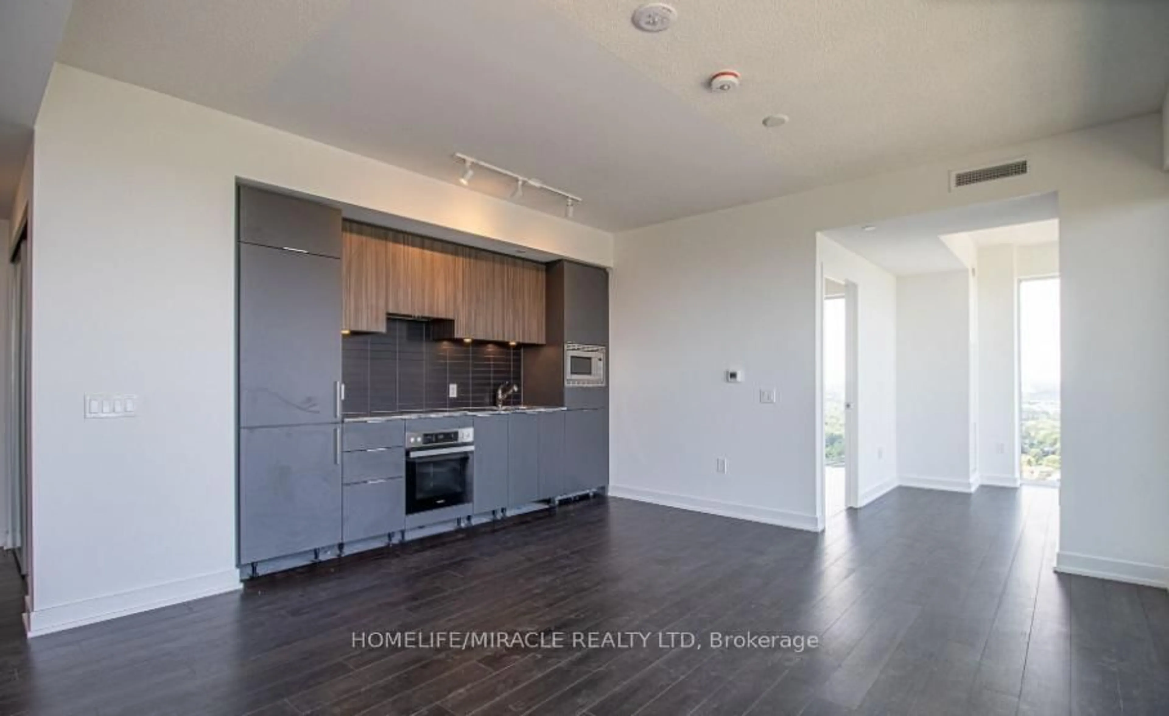 Open concept kitchen, wood/laminate floor for 50 O'Neill Rd #2704, Toronto Ontario M3C 0R1