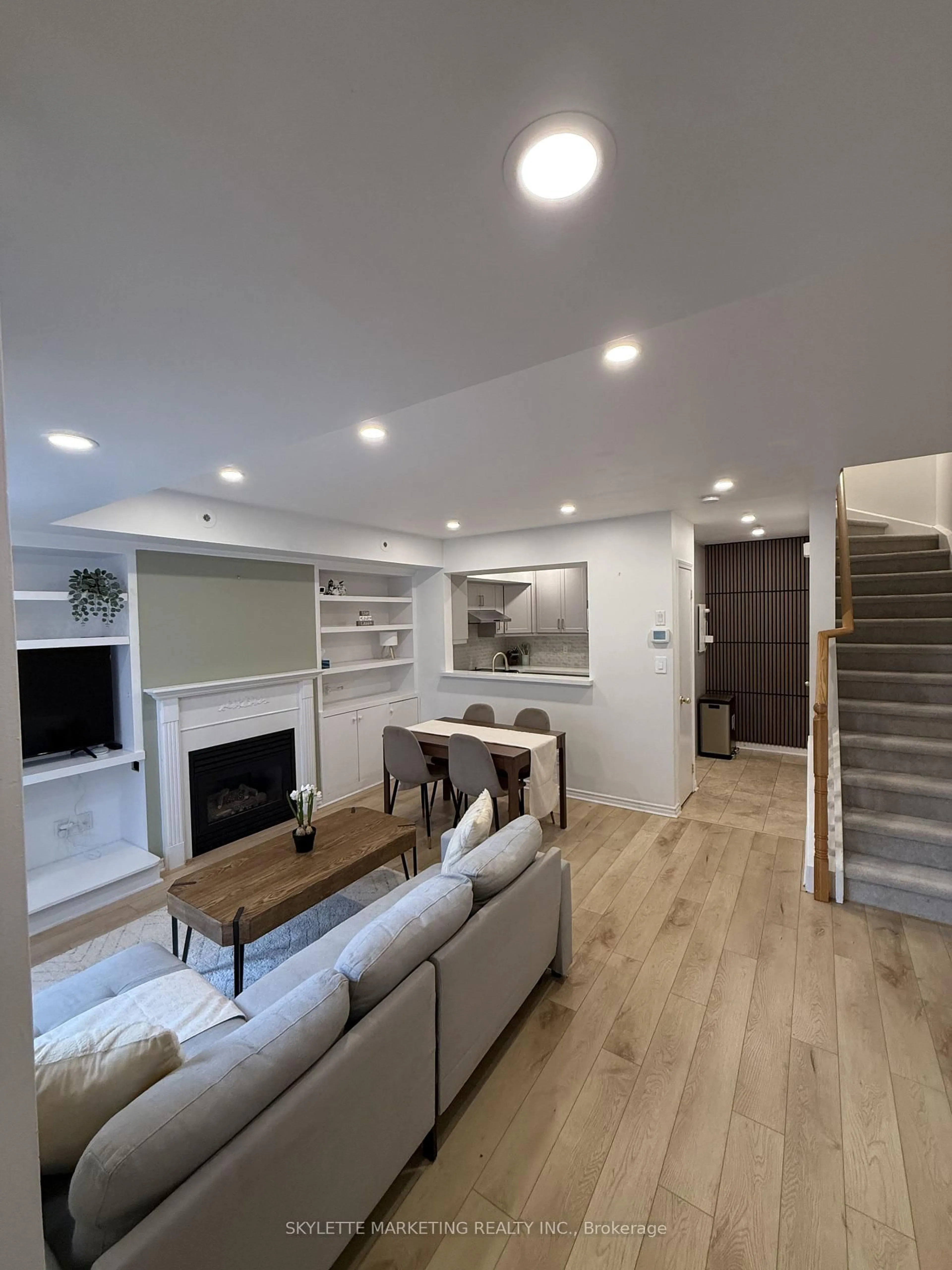 Living room with furniture, wood/laminate floor for 3 Everson Dr #123, Toronto Ontario M2N 7C2