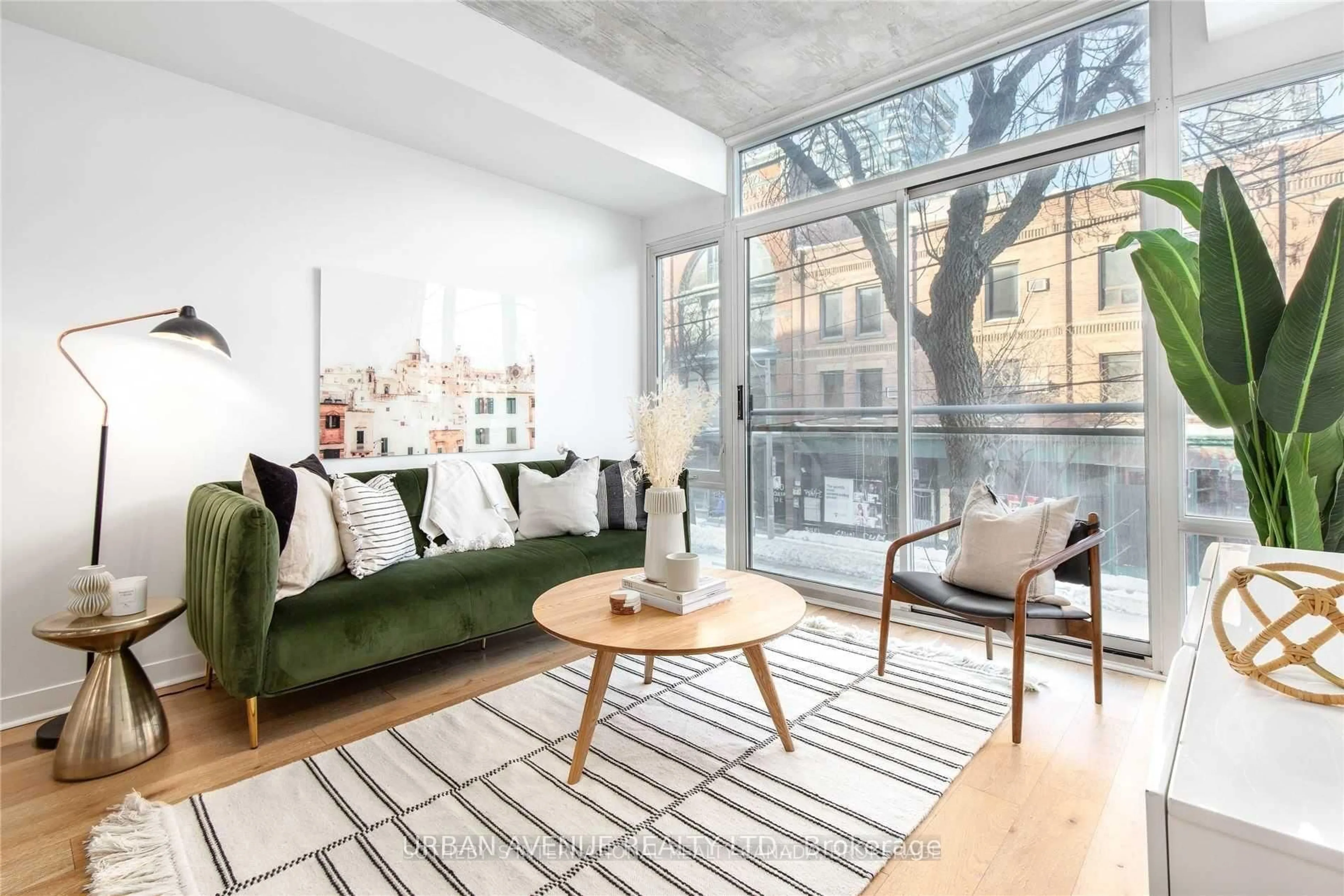 Living room with furniture, cement floor for 127 Queen St #207, Toronto Ontario M5C 1S3