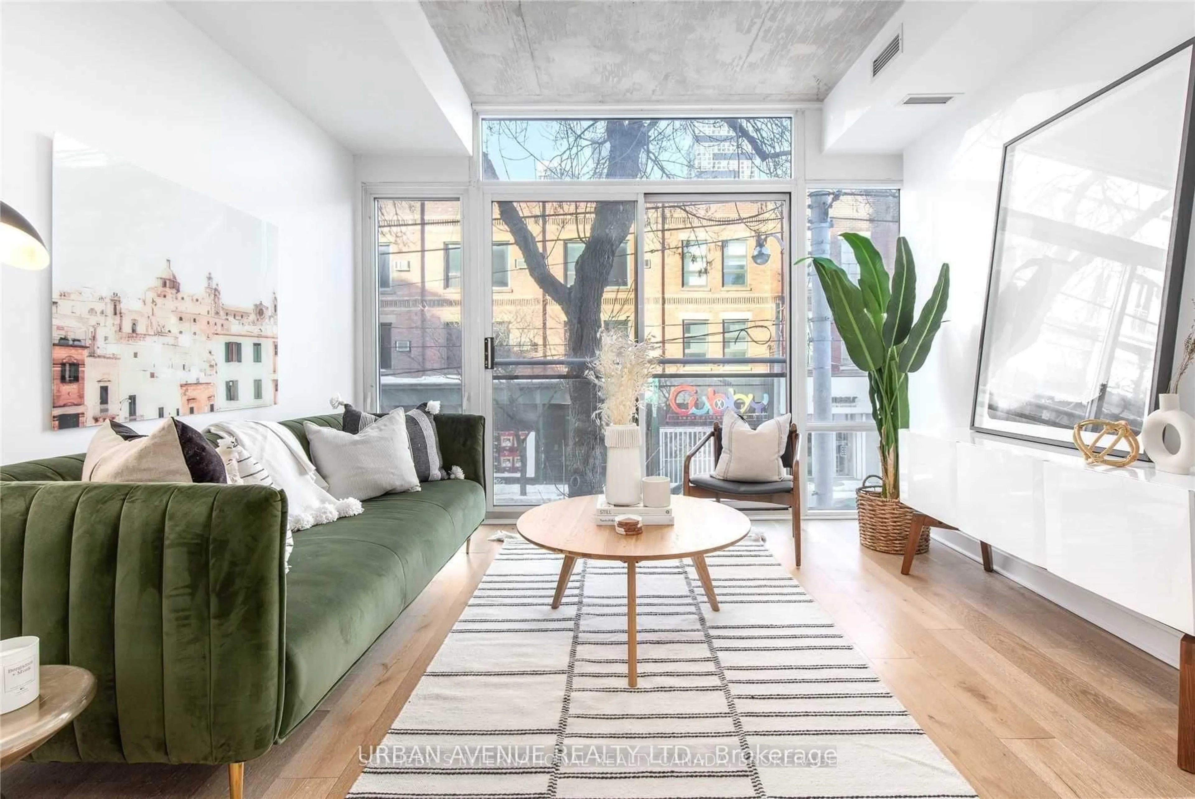 Living room with furniture, cement floor for 127 Queen St #207, Toronto Ontario M5C 1S3