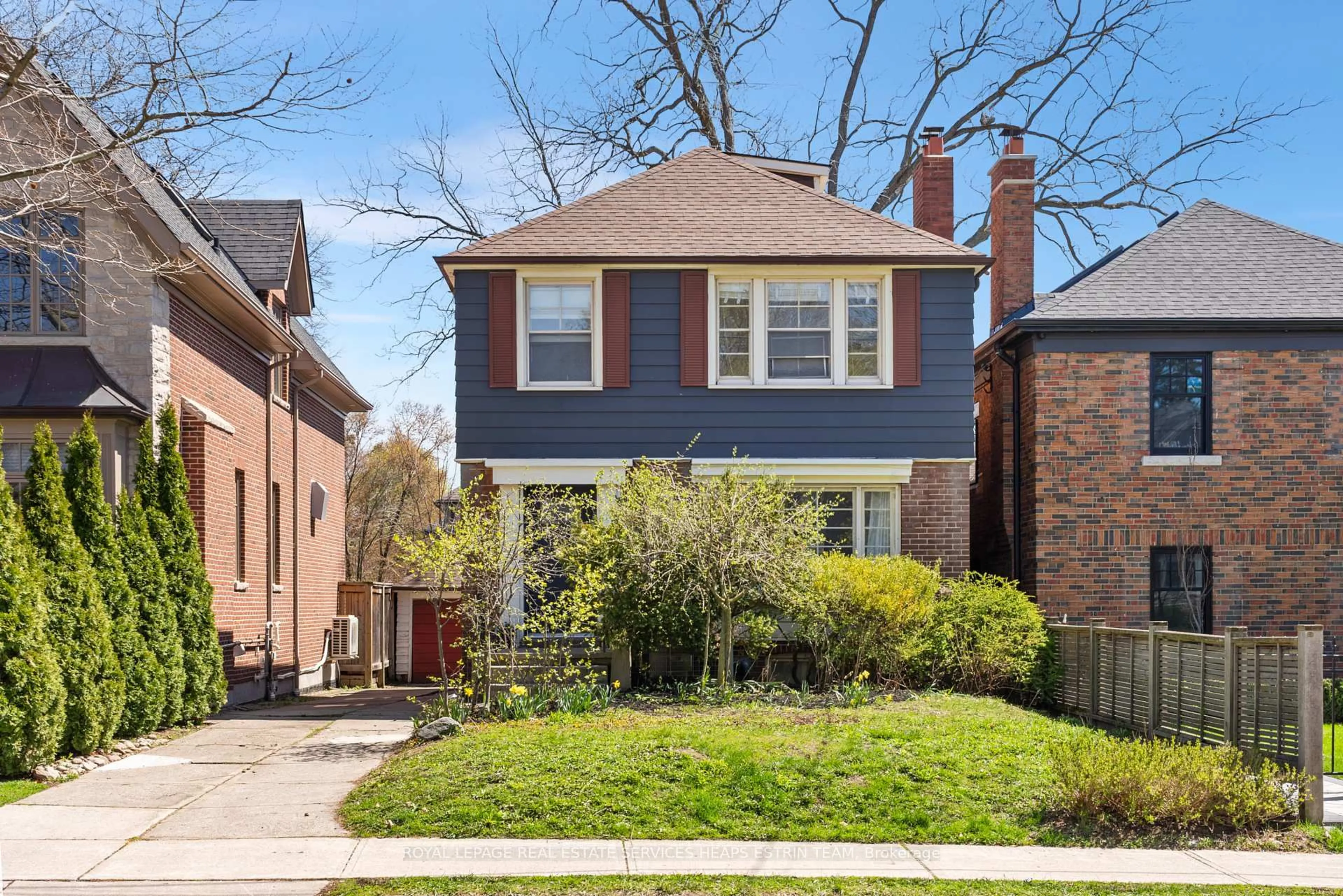 Home with brick exterior material, street for 61 Sutherland Dr, Toronto Ontario M4G 1H5