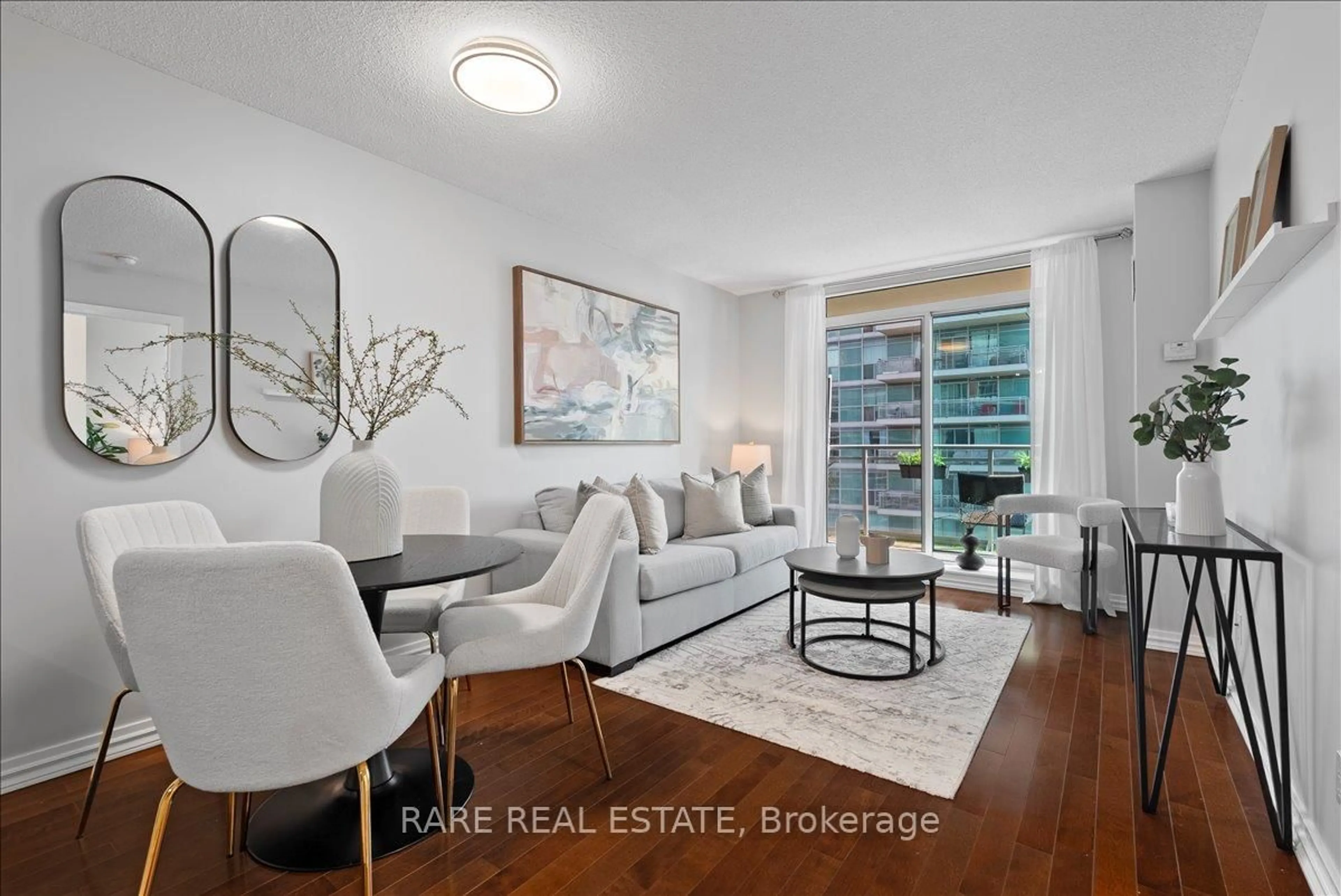 Living room with furniture, wood/laminate floor for 50 Lynn Williams St #2211, Toronto Ontario M6K 3R9