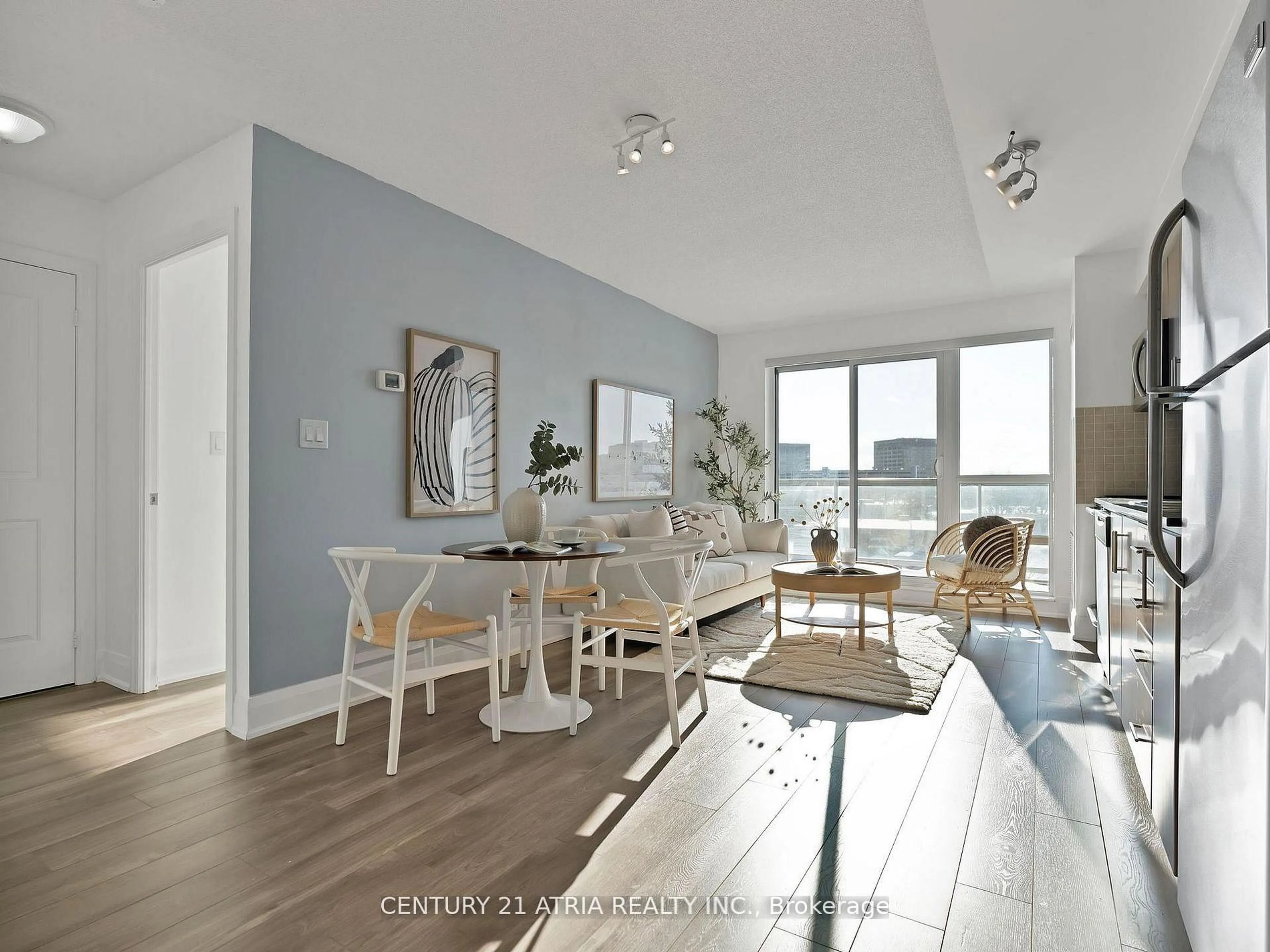 Living room with furniture, wood/laminate floor for 30 Herons Hills Way #308, Toronto Ontario M2J 0A7