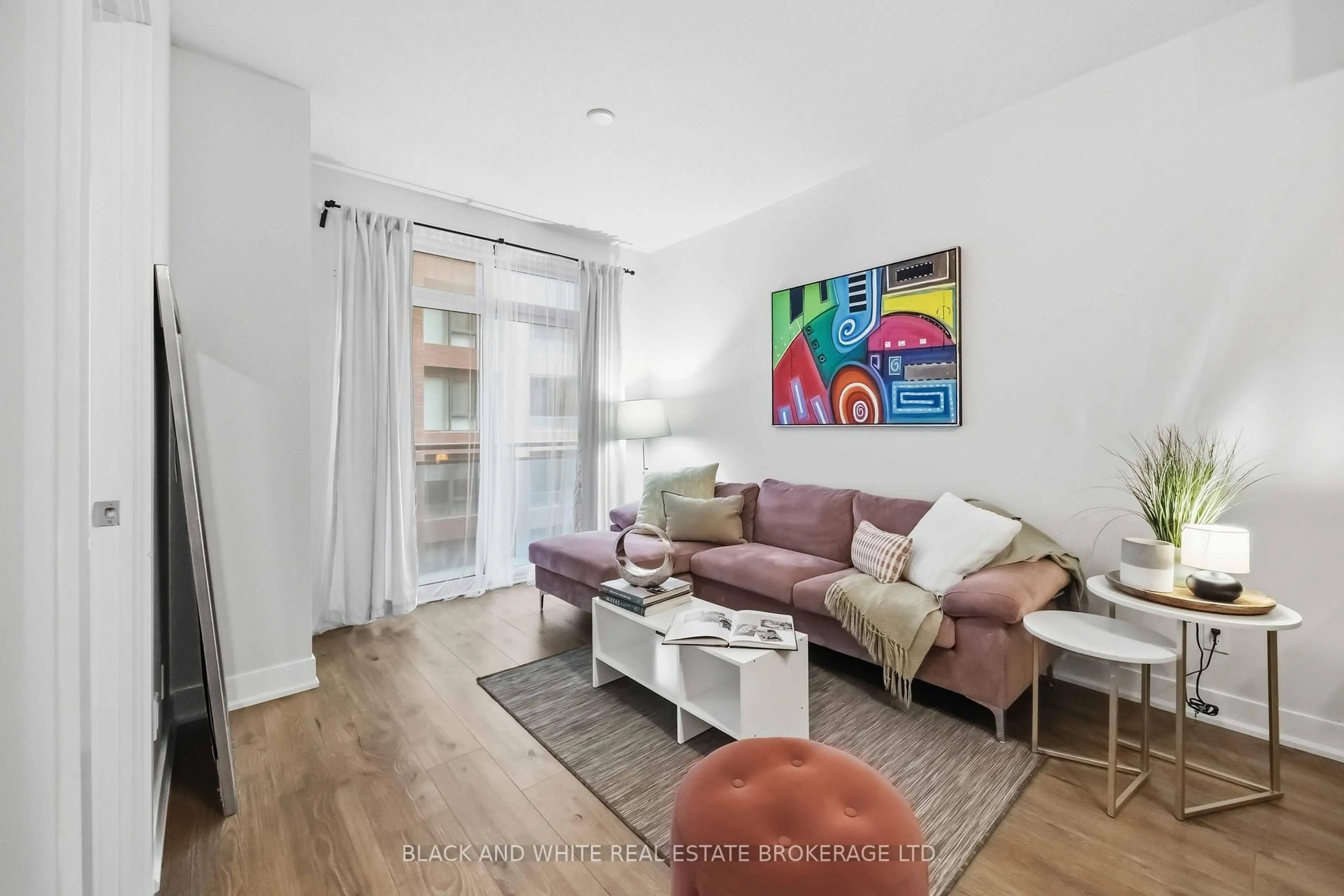 Living room with furniture, wood/laminate floor for 28 Linden St #909, Toronto Ontario M4Y 0A4