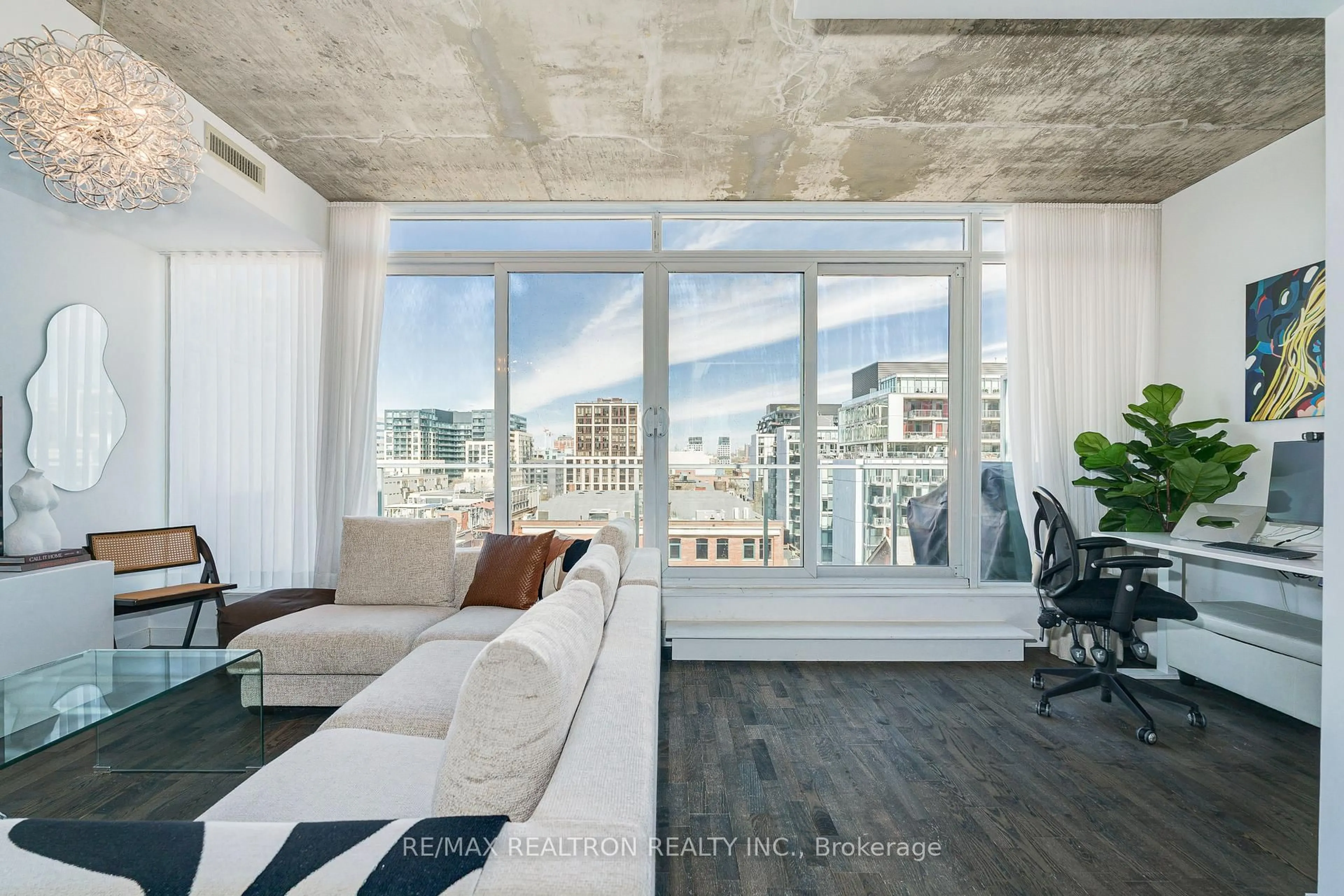 Living room with furniture, cement floor for 75 Portland St #1003, Toronto Ontario M5V 2M9
