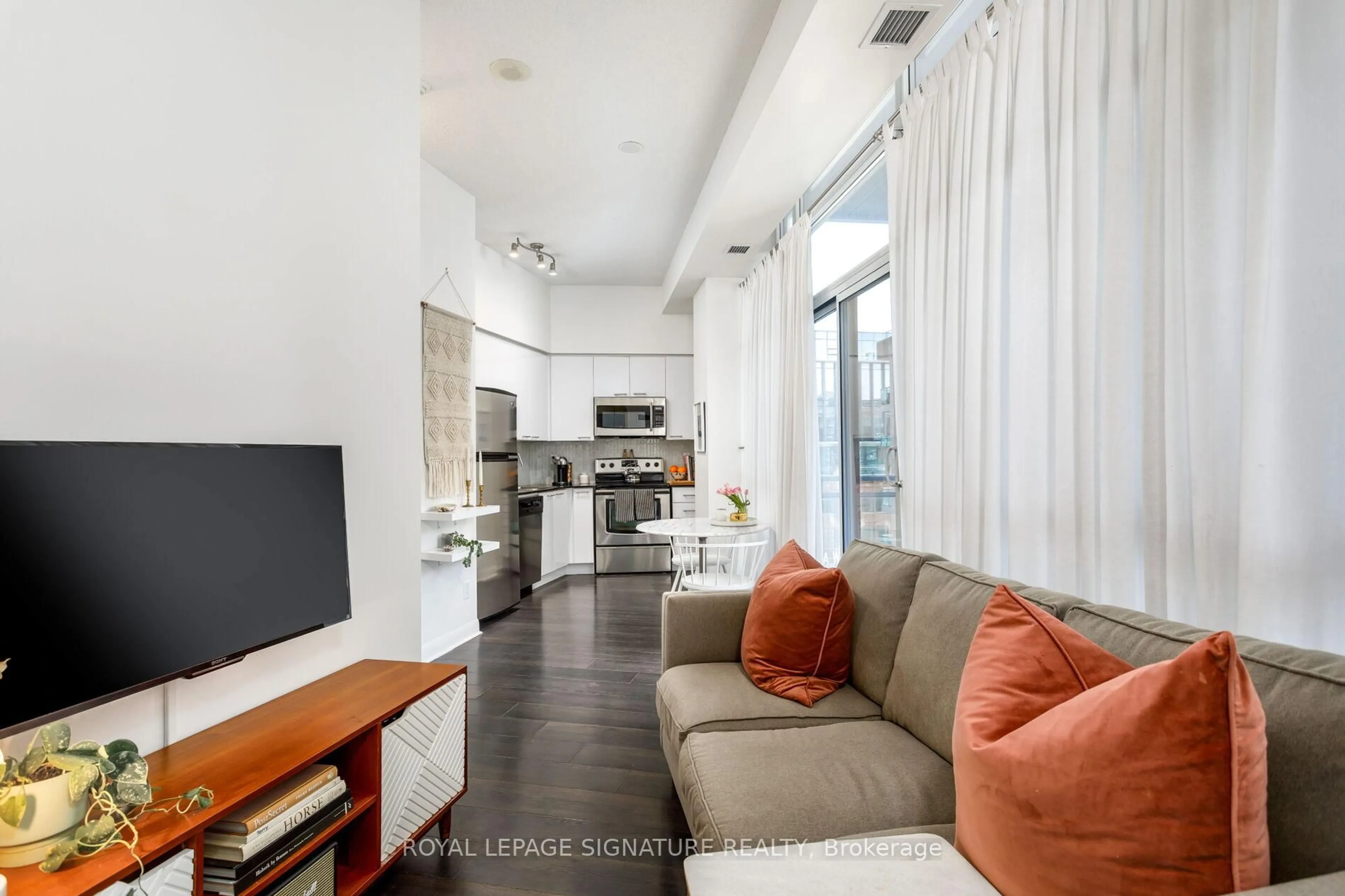Living room with furniture, unknown for 15 Bruyeres Mews #705, Toronto Ontario M5V 0A7